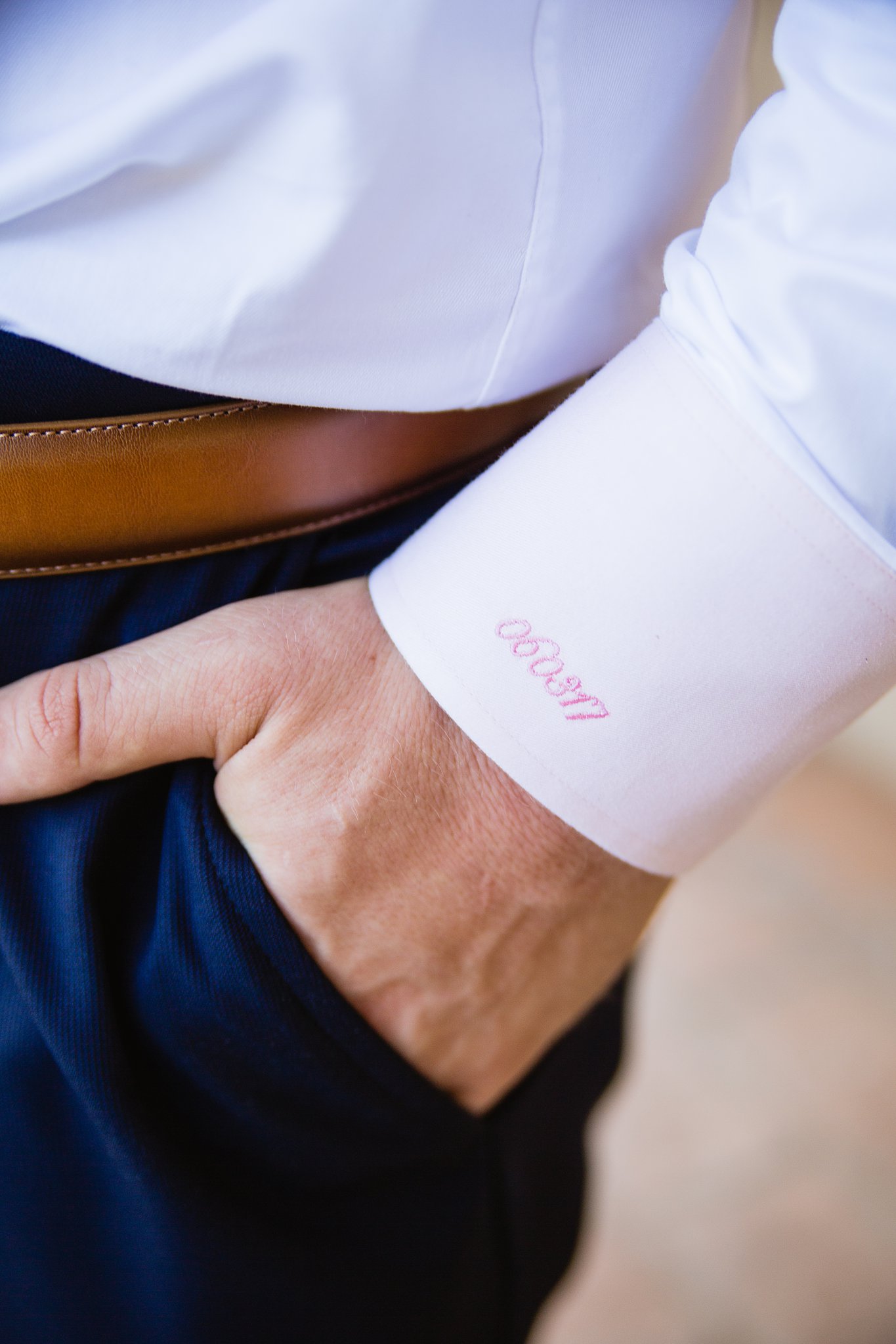 Groom's wedding day details of the wedding date embroidered into his shirt cuff by PMA Photography.
