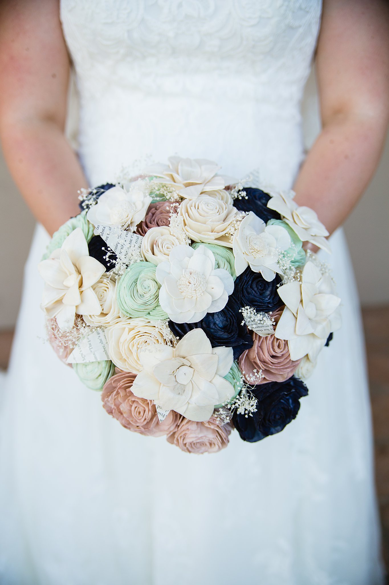Bride's wood flower bouquet by PMA Photography.