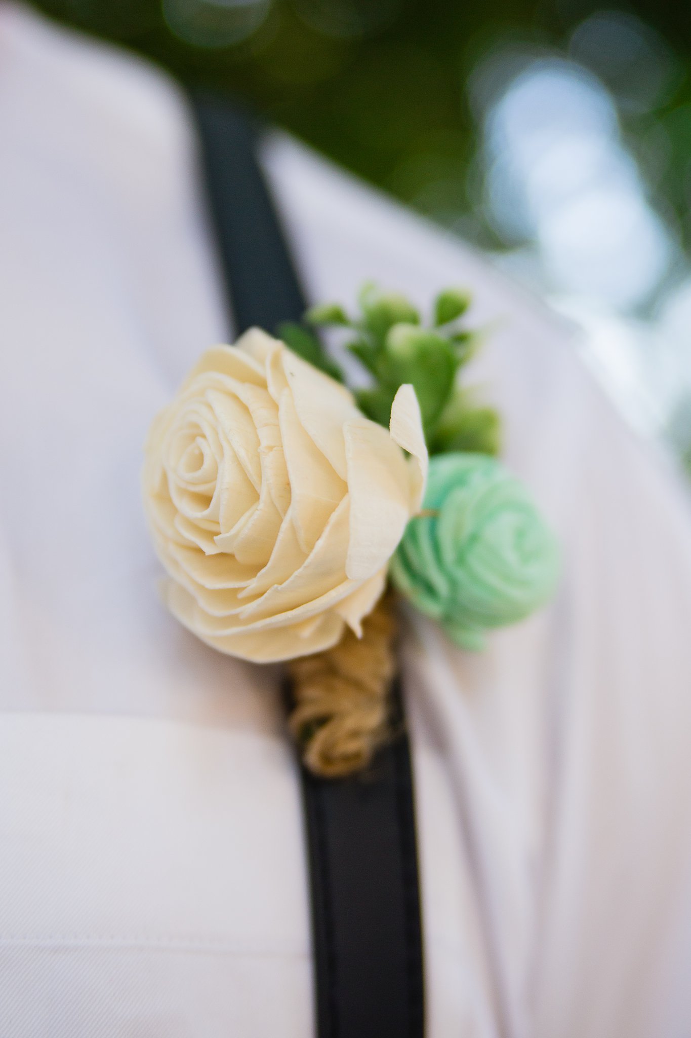 Groom's wooden flower boutonniere by PMA Photography.