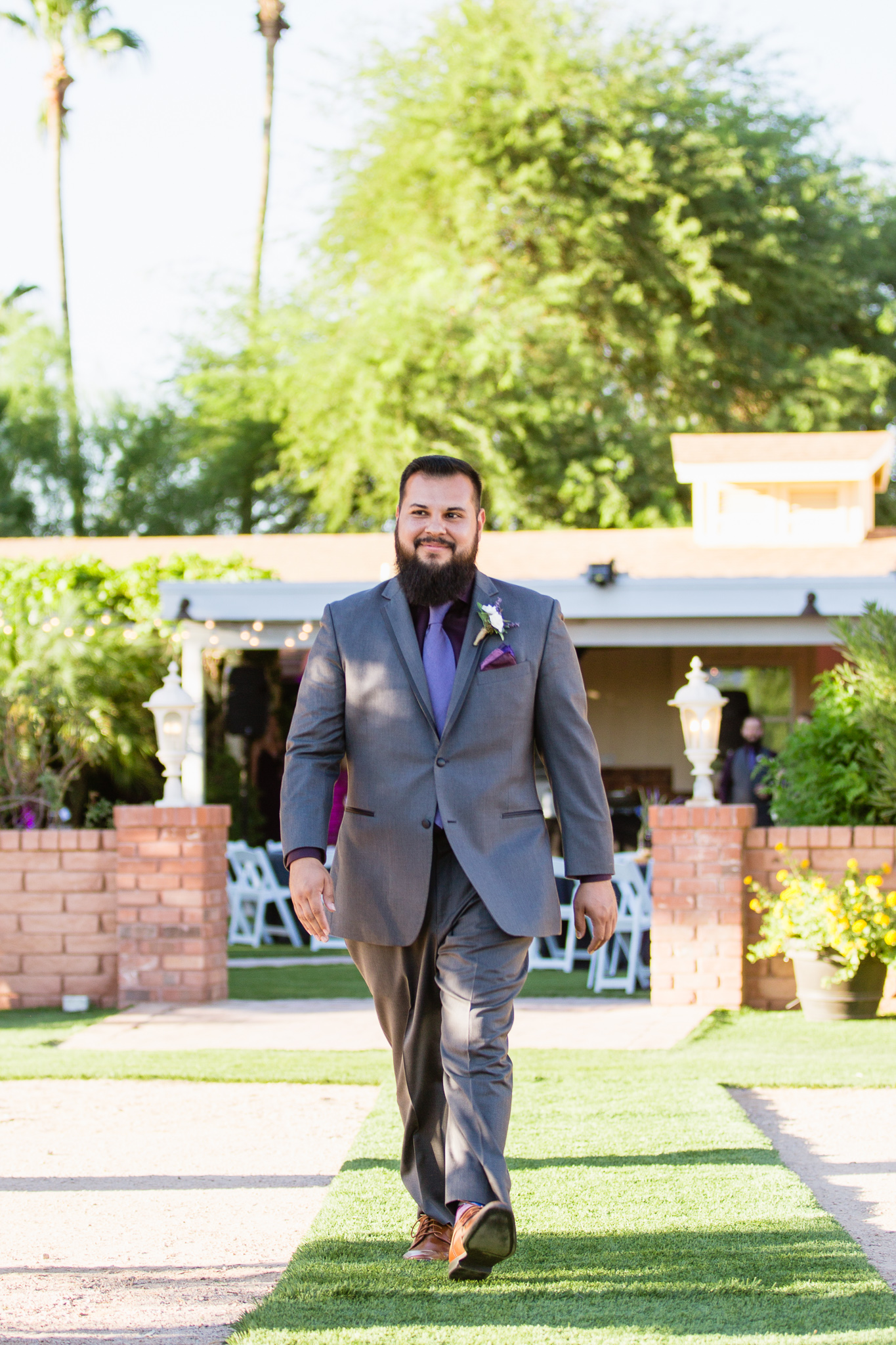 Groom walking down the aisle at Schnepf Farms by wedding photographer PMA Photography.