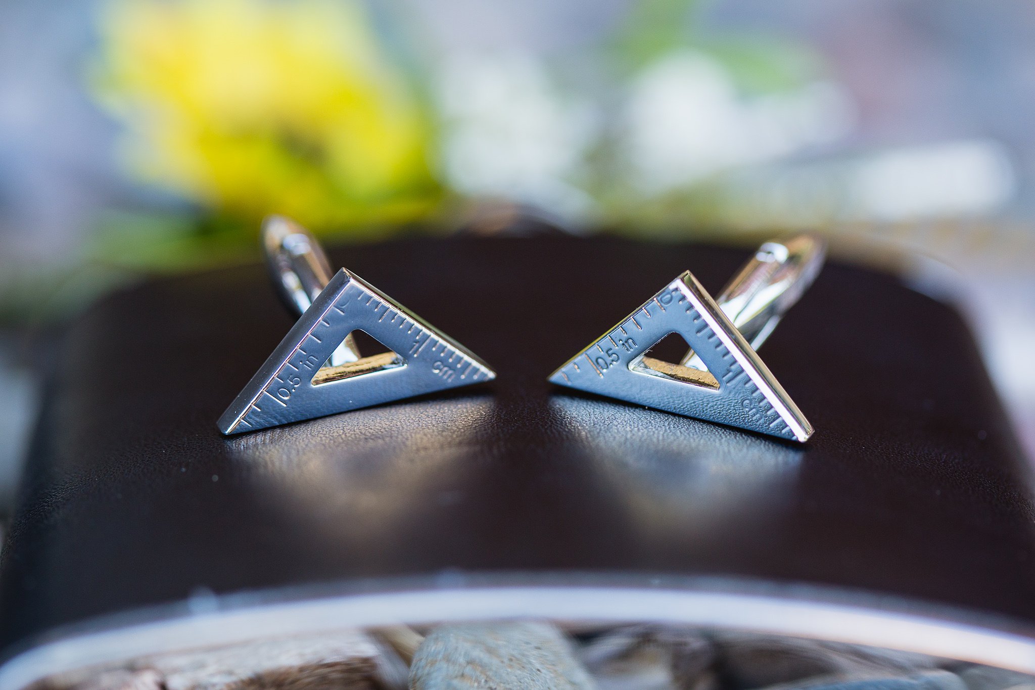Groom's wedding details of a triangle ruler cuff links for architect major groom by Arizona wedding photographer by PMA Photography.