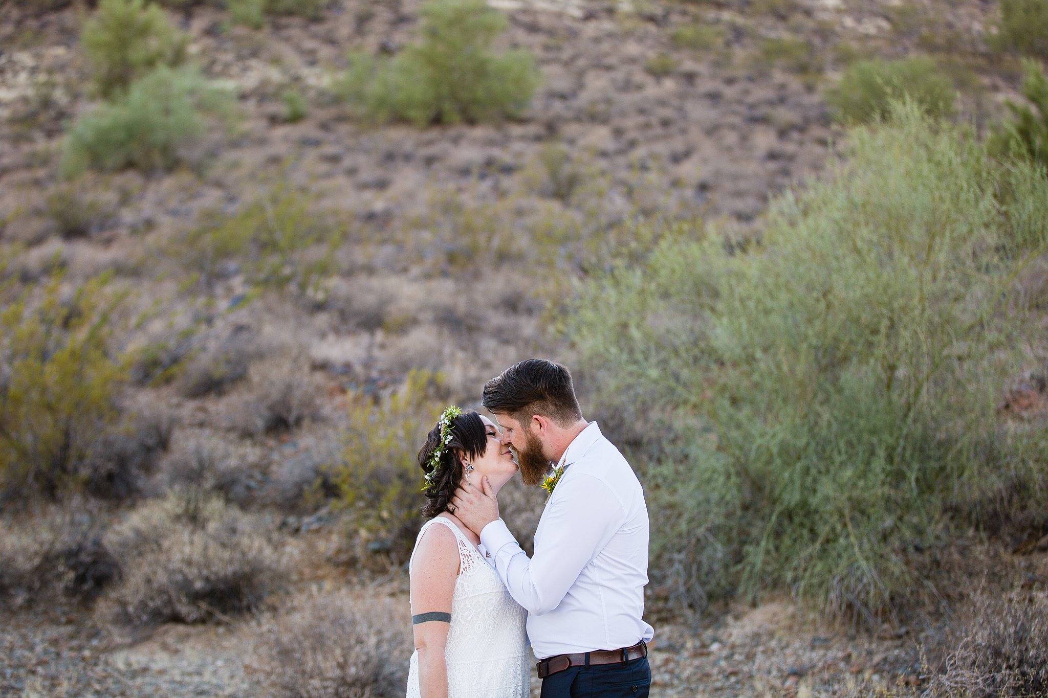 Bride and groom share an intimate moment during their first look by Arizona wedding photographers PMA Photography.