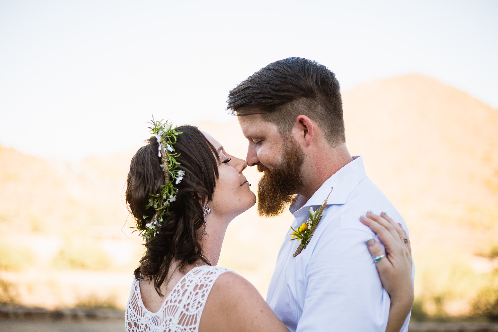 Bride and groom share a romantic moment by Phoenix wedding photographer PMA Photography.