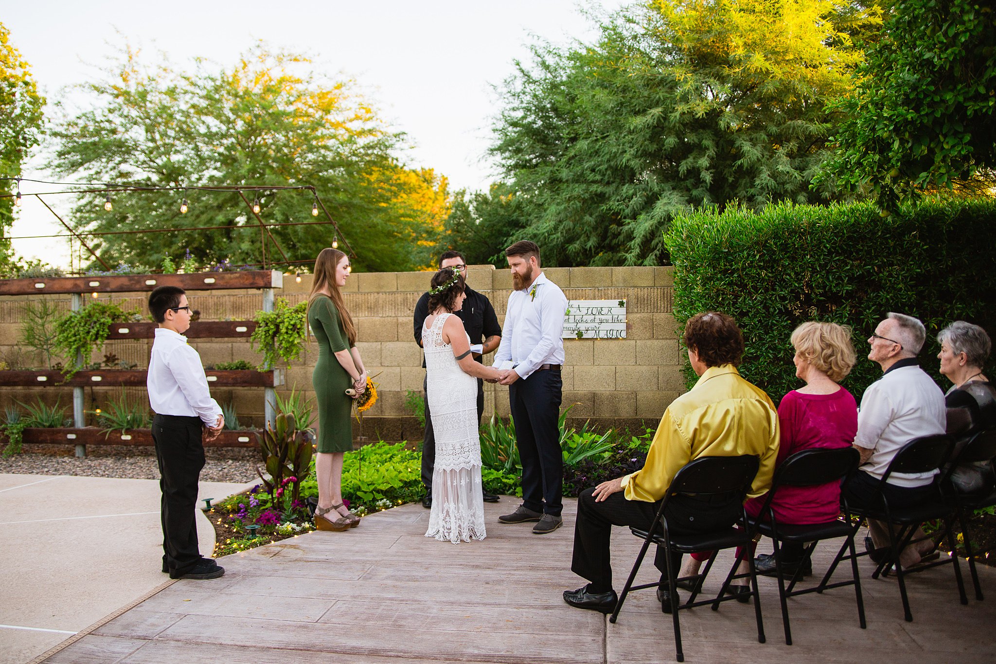 Arizona backyard garden wedding ceremony by Phoenix wedding photographer PMA Photography.