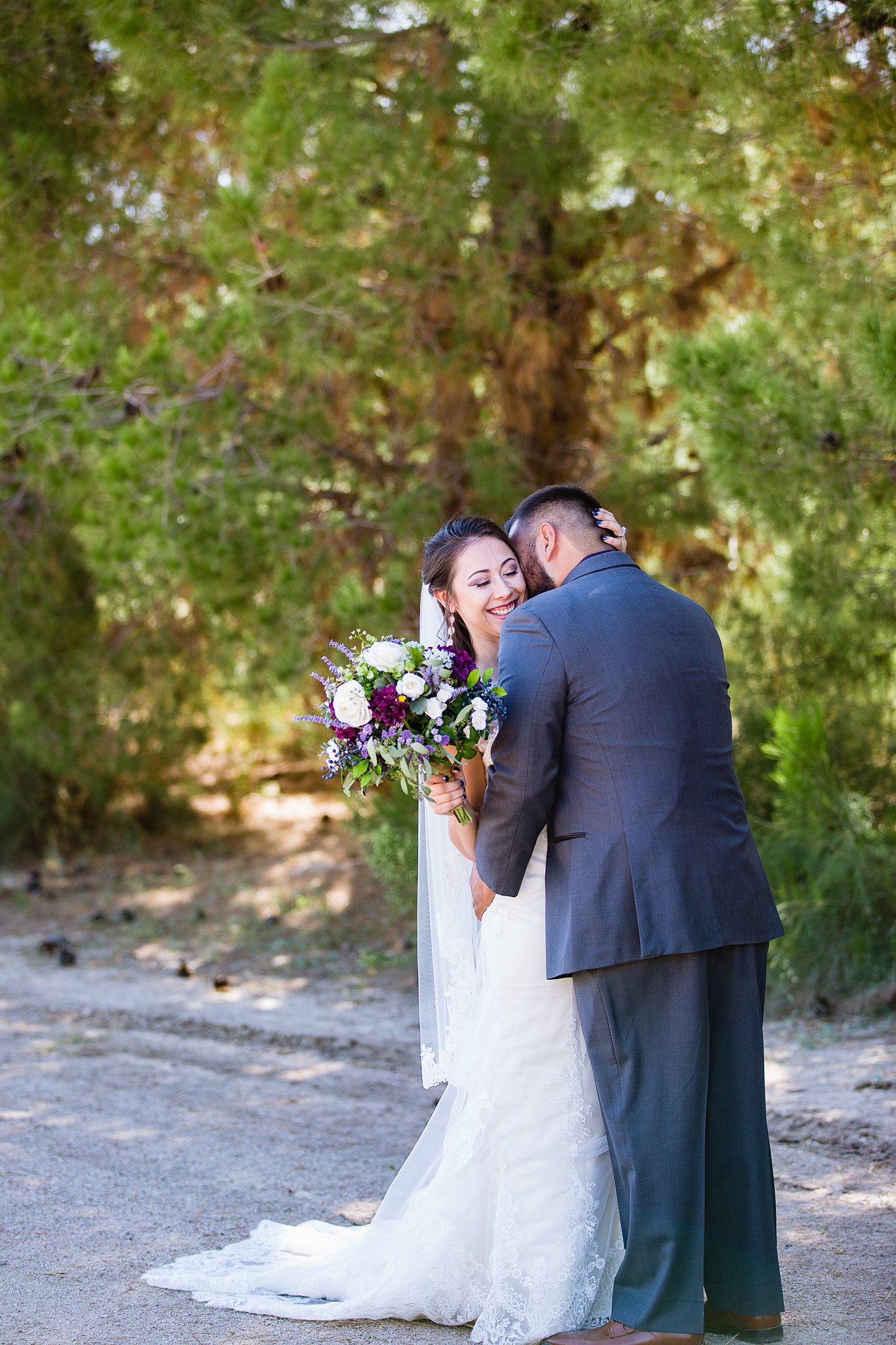 Bride and groom share an intimate moment during their first look during their Schnepf Farms wedding by Arizona wedding photographer PMA Photography.