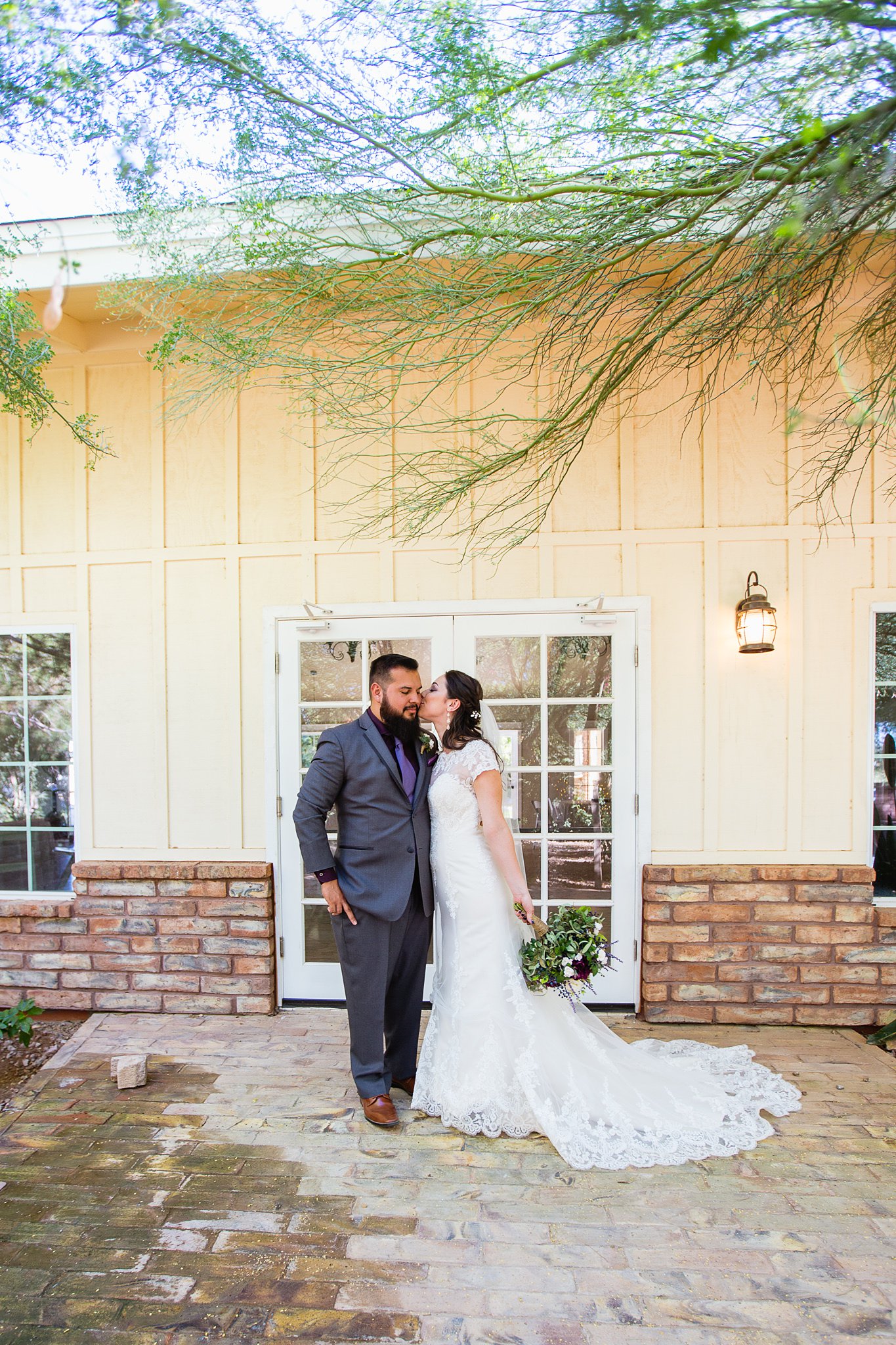 Bride and groom at Schnepf Farm's Farmhouse by Arizona wedding photographers PMA Photography.