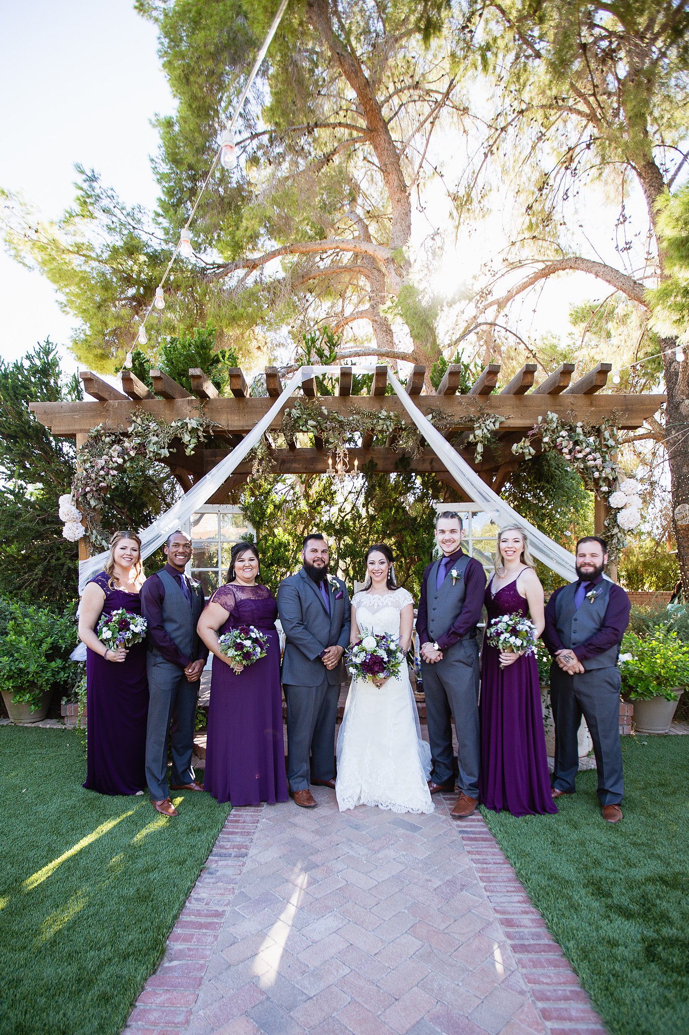 Purple and grey bridal party at the Schnepf Farms Farmhouse by Phoenix wedding photographer PMA Photography.