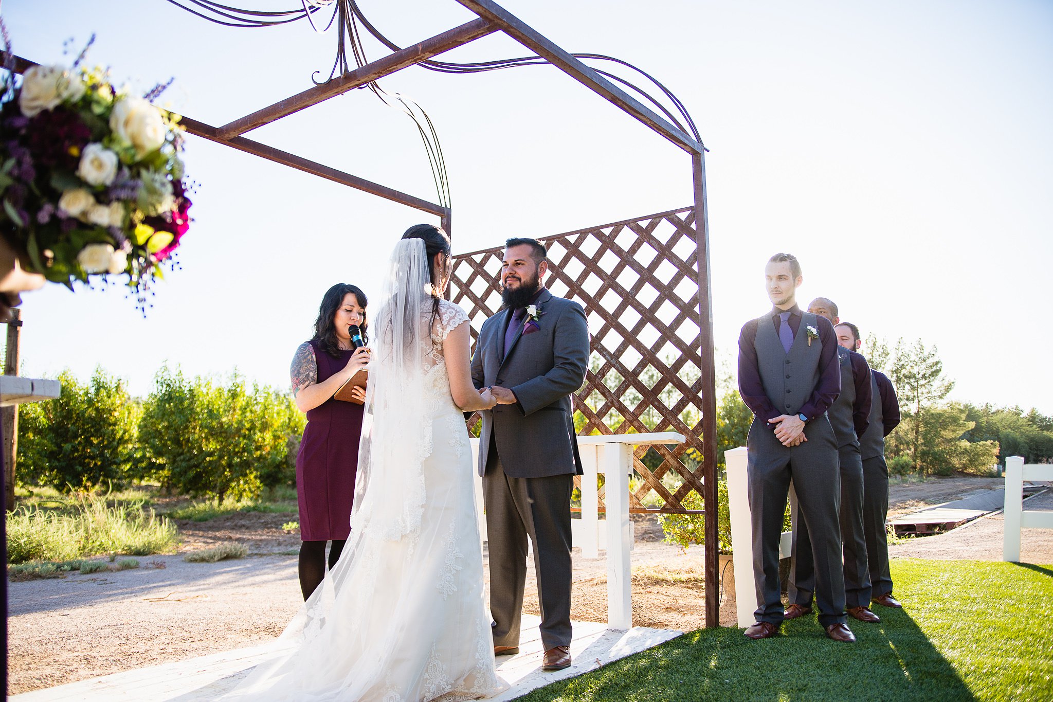 Wedding ceremony at the Schnepf Farm's Farmhouse by Arizona wedding photographer PMA Photography.