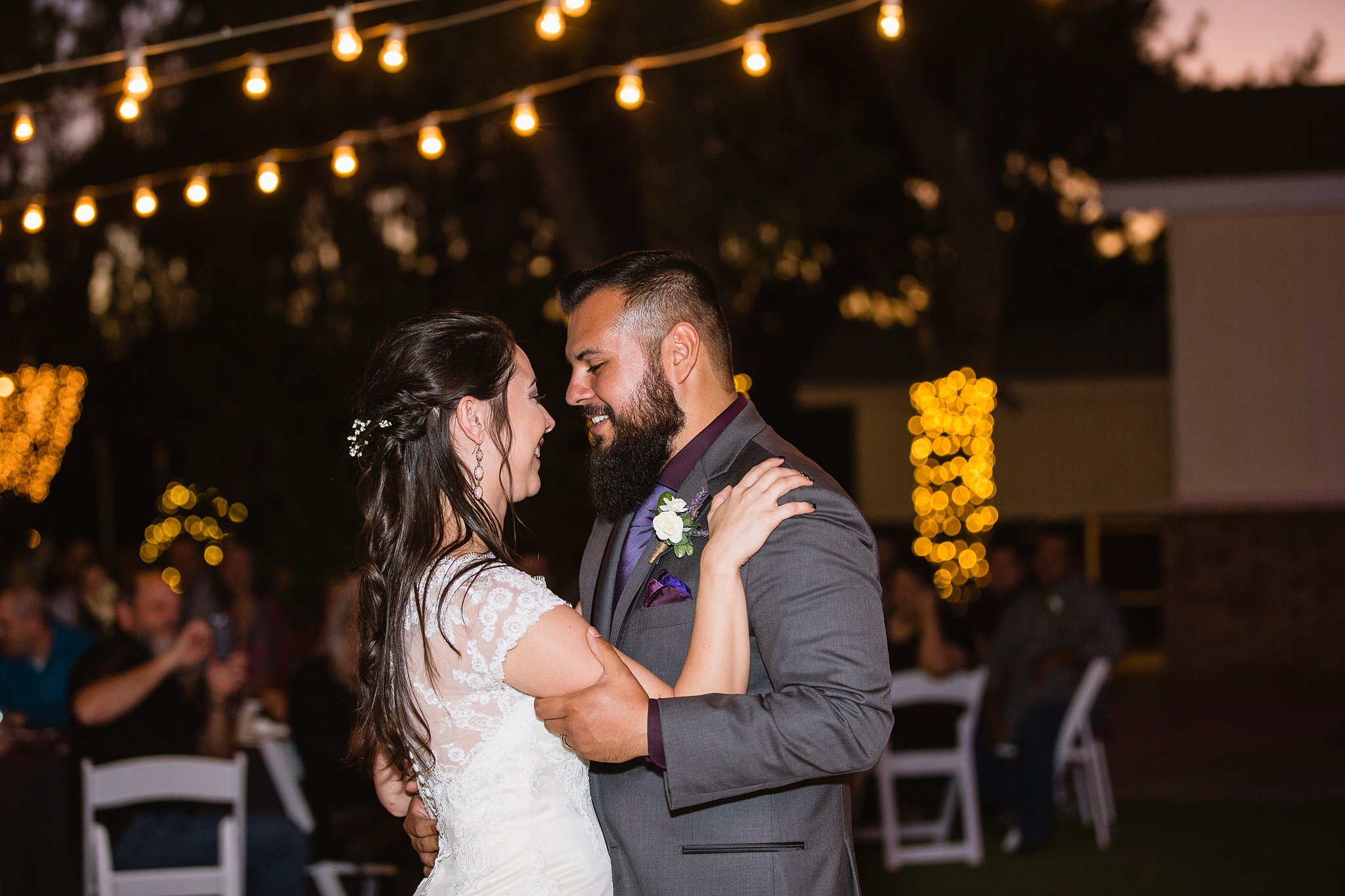Bride and groom's first dance at their Schnepf Farms Farmhouse wedding reception by Arizona wedding photographer PMA Photography.