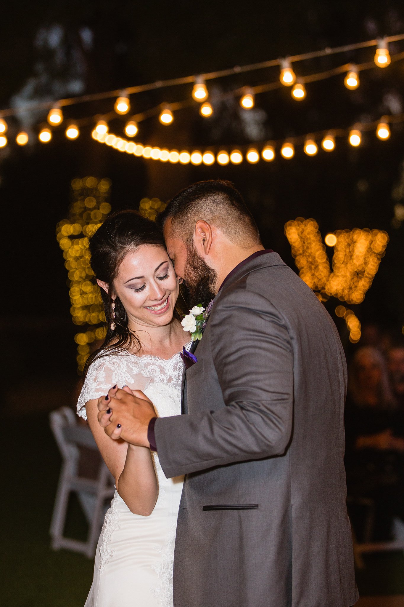 Bride and groom's first dance at their Schnepf Farms Farmhouse wedding reception by Arizona wedding photographer PMA Photography.