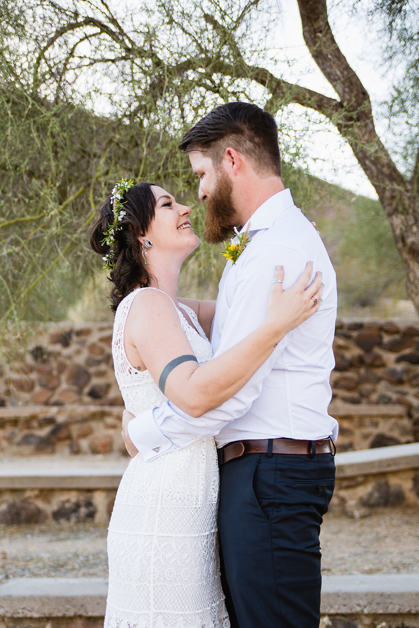 Simple boho bride and groom in the Arizona desert by Phoenix wedding photographers PMA Photography.
