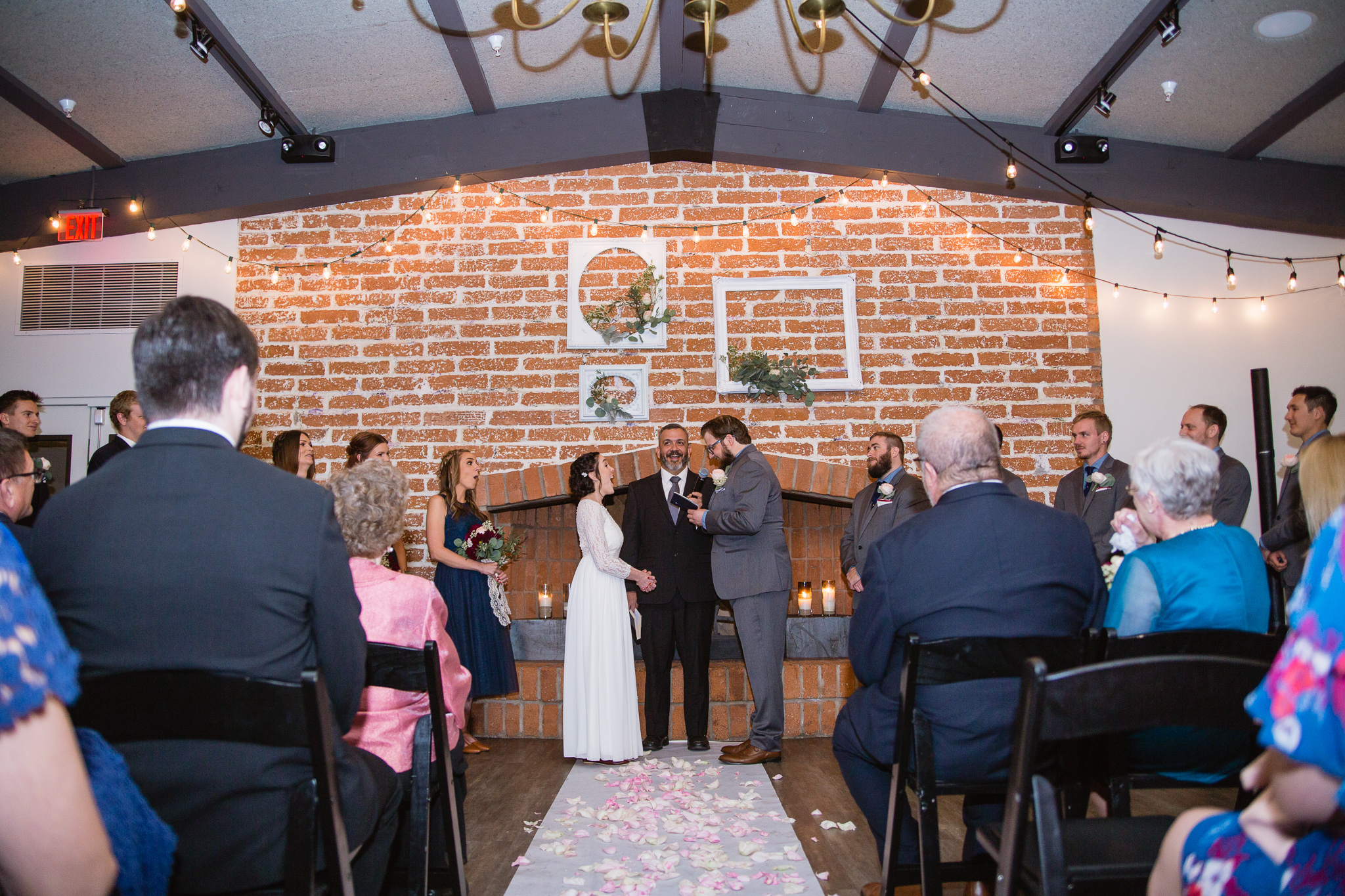 Groom surprising bride and other guest with his personal vows during their wedding ceremony.
