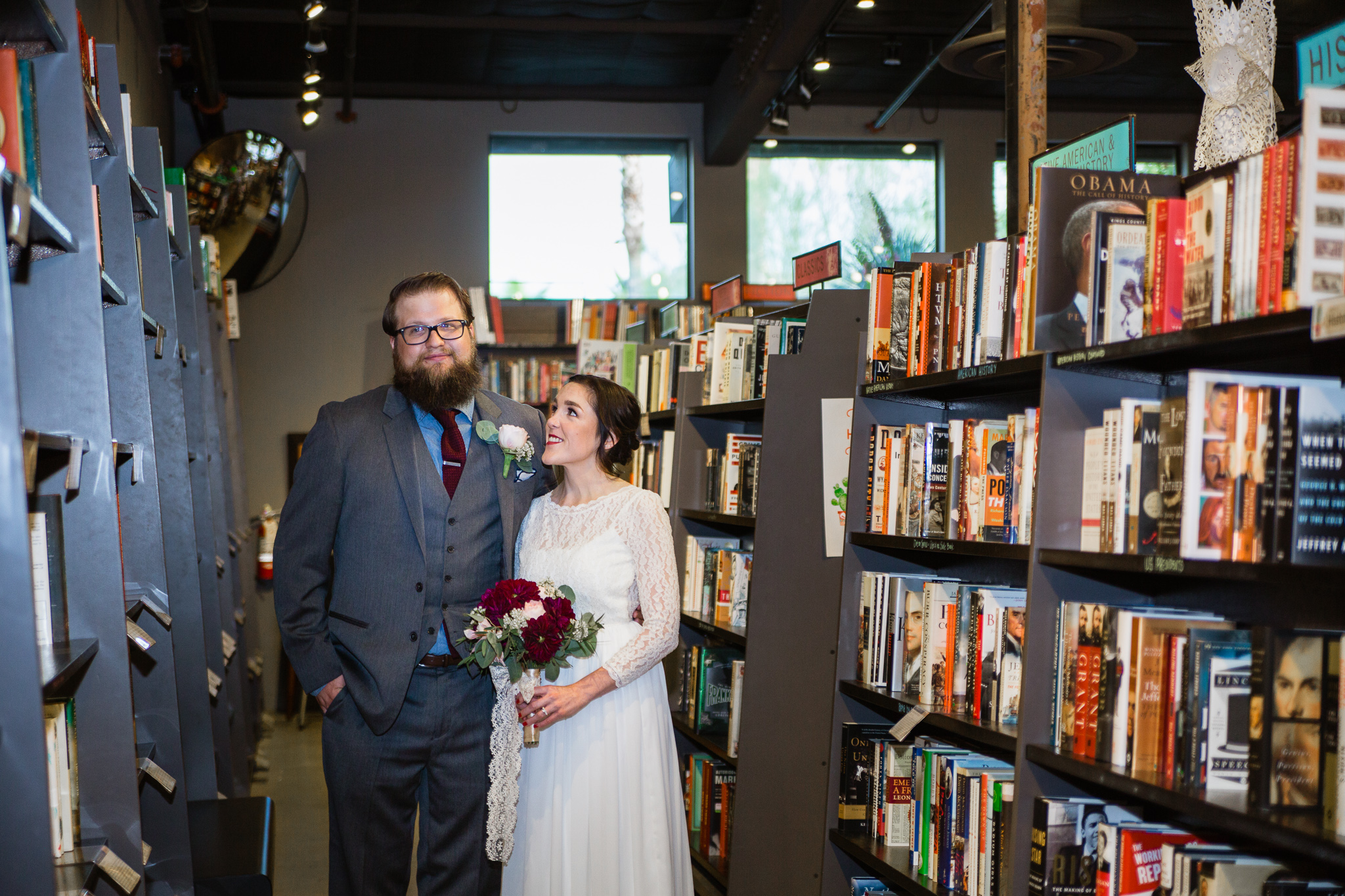 Vintage inspired bride and groom in Changing Hands bookstore at their book themed wedding in downtown Phoenix.