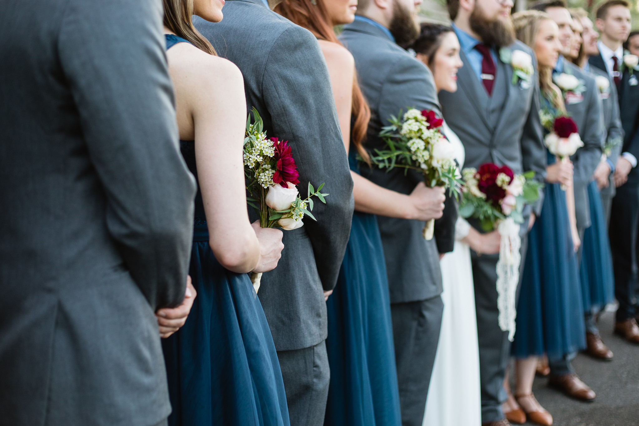 Navy, grey, and maroon bridal party details.