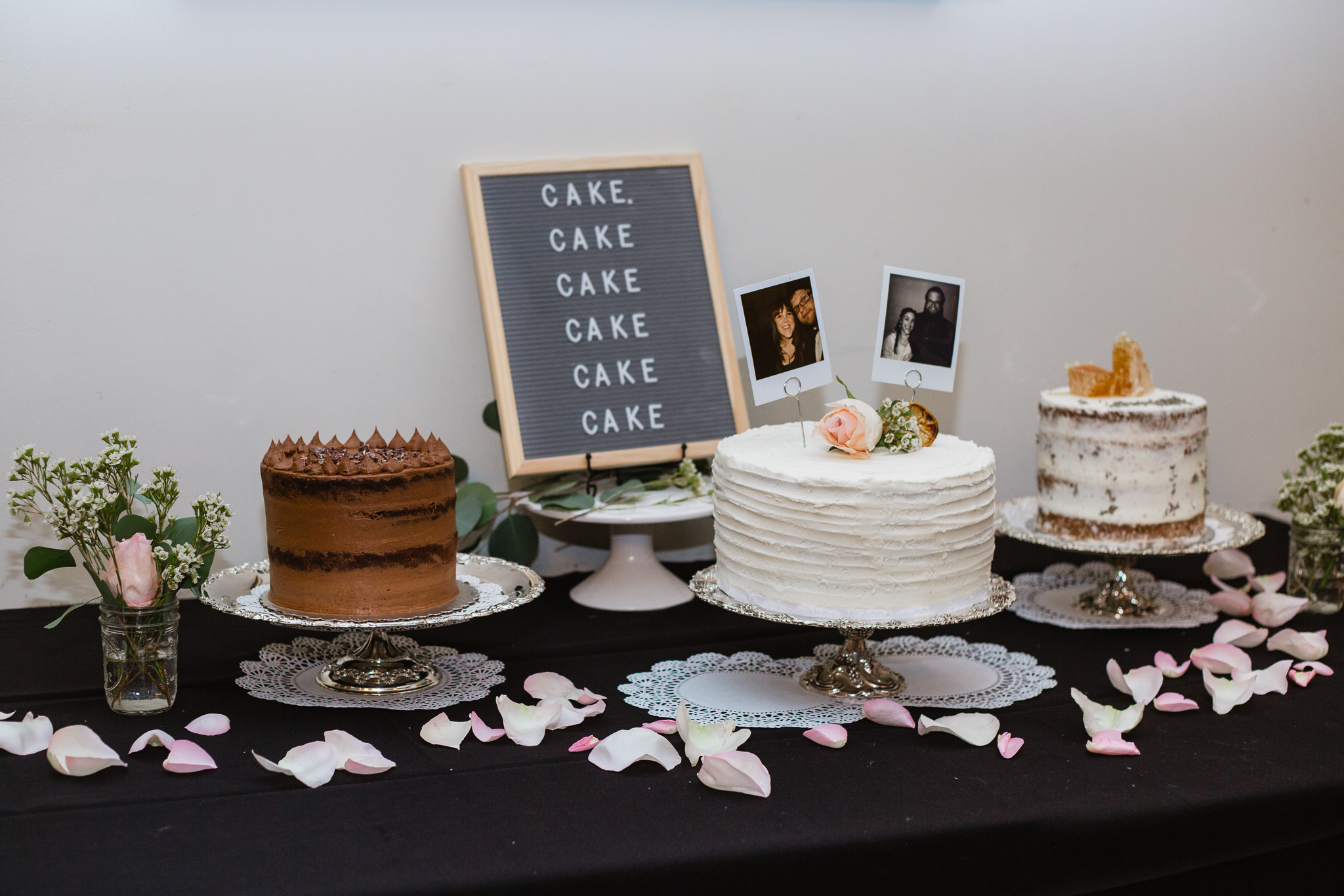 Vintage inspired cake table with cakes of orange, chocolate, and honey and lavender by Bear and the Honey Phoenix.