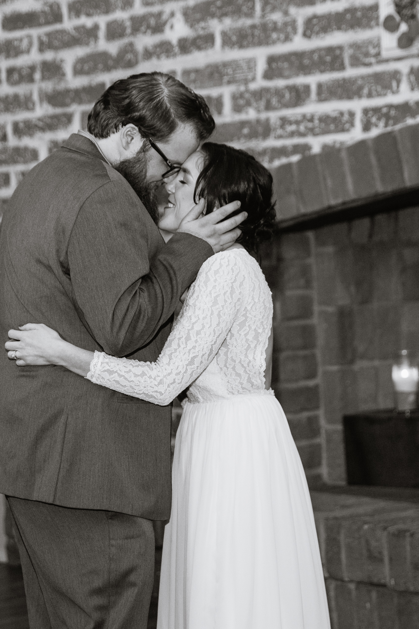 Bride and groom share an intimate moment during the first dance at their wedding reception.