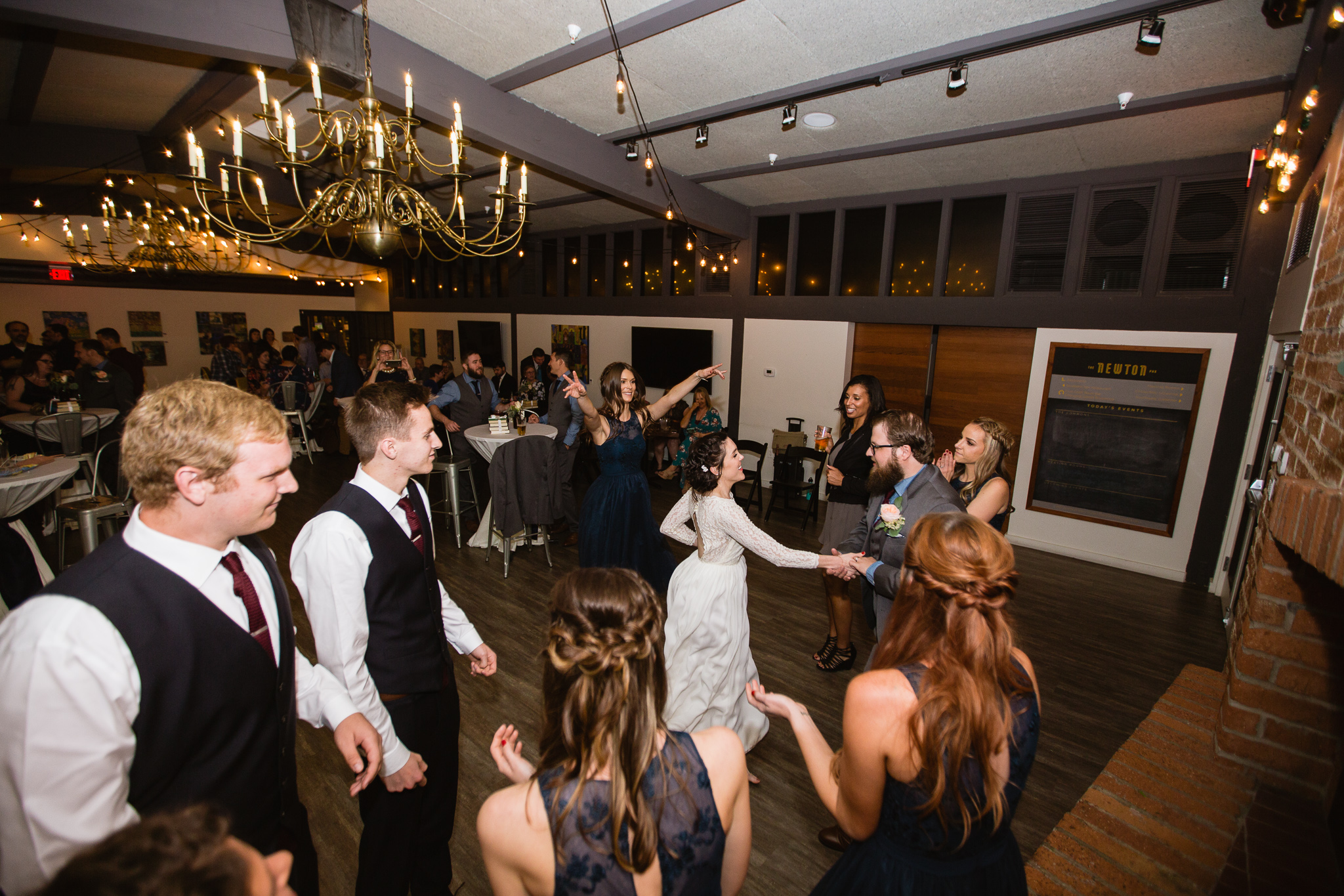 Bride and Groom dancing with guests at their wedding reception at The Newton in Phoenix Arizona