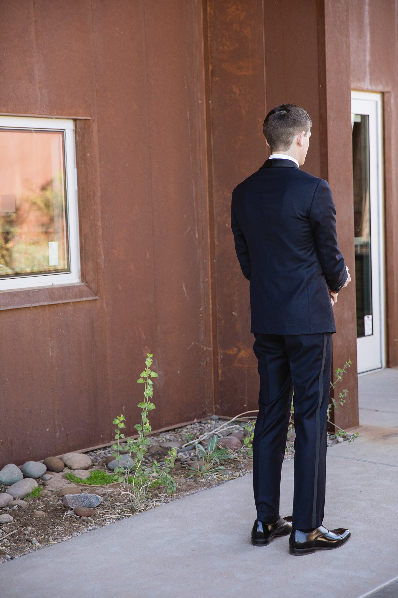 Groom just before his first look of his bride at the Rio Salado Audubon wedding venue in Phoenix Arizona by wedding photographer PMA Photography.