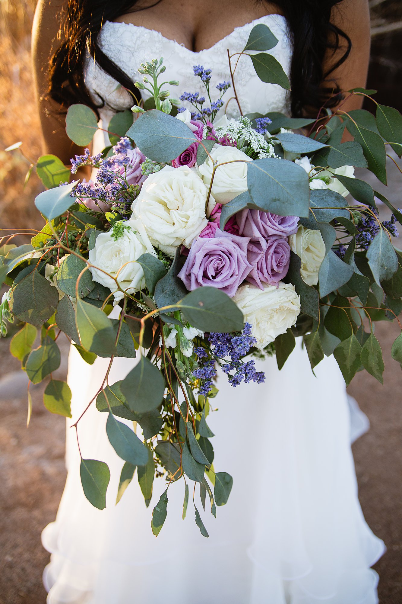 Lavender and white bridal bouquet by wedding photographer PMA Photography.
