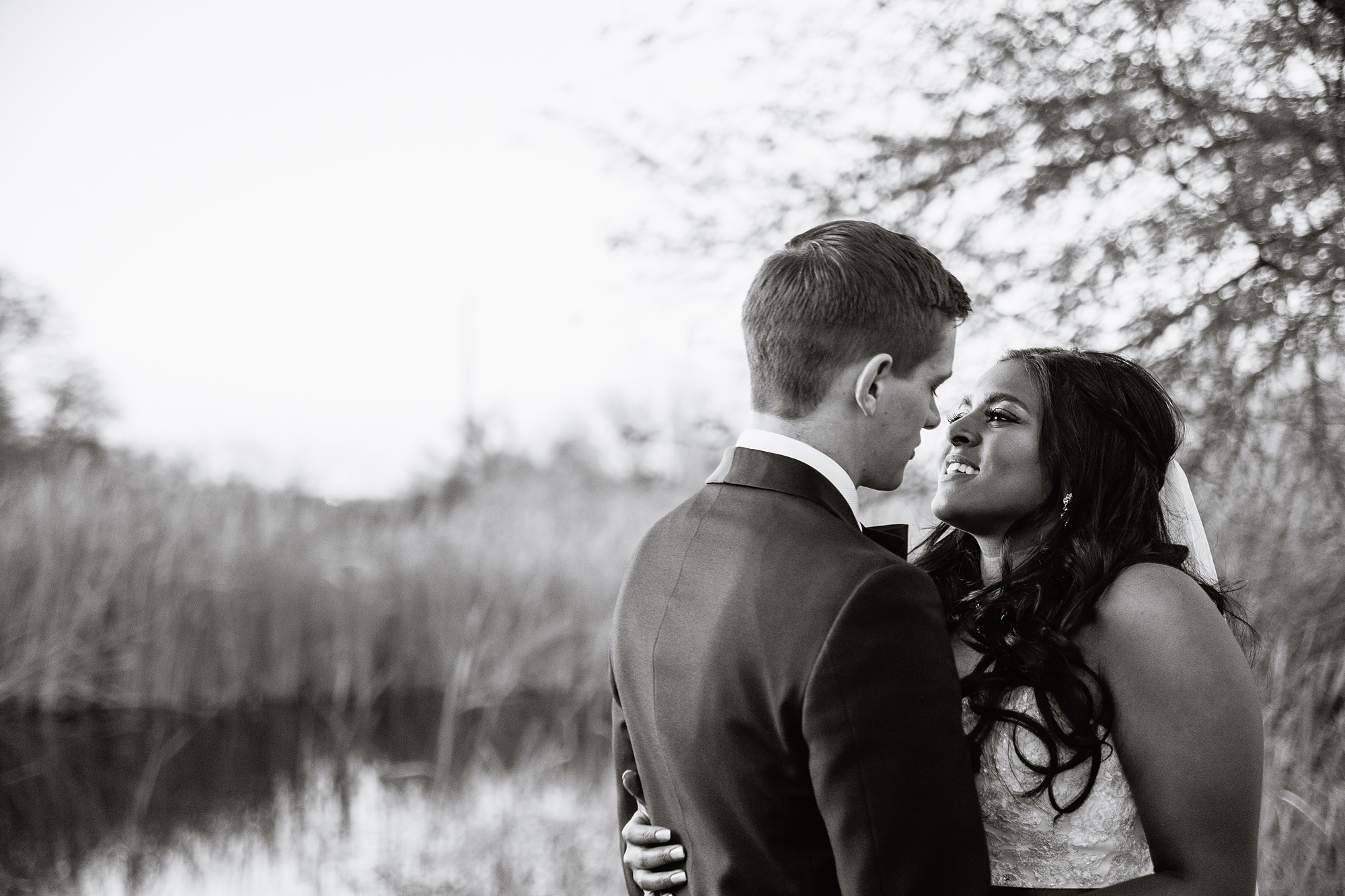 Bride and groom share an loving intimate moment at the Rio Salado Audubon center by Phoenix wedding photographer PMA Photography.