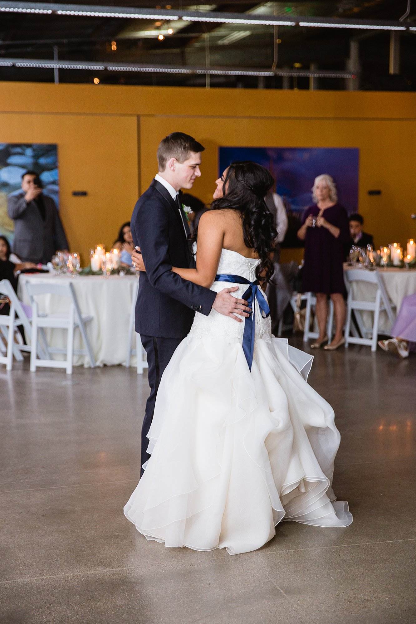Bride and groom share their first dance at at the Rio Salado Audubon center by Phoenix wedding photographer PMA Photography.