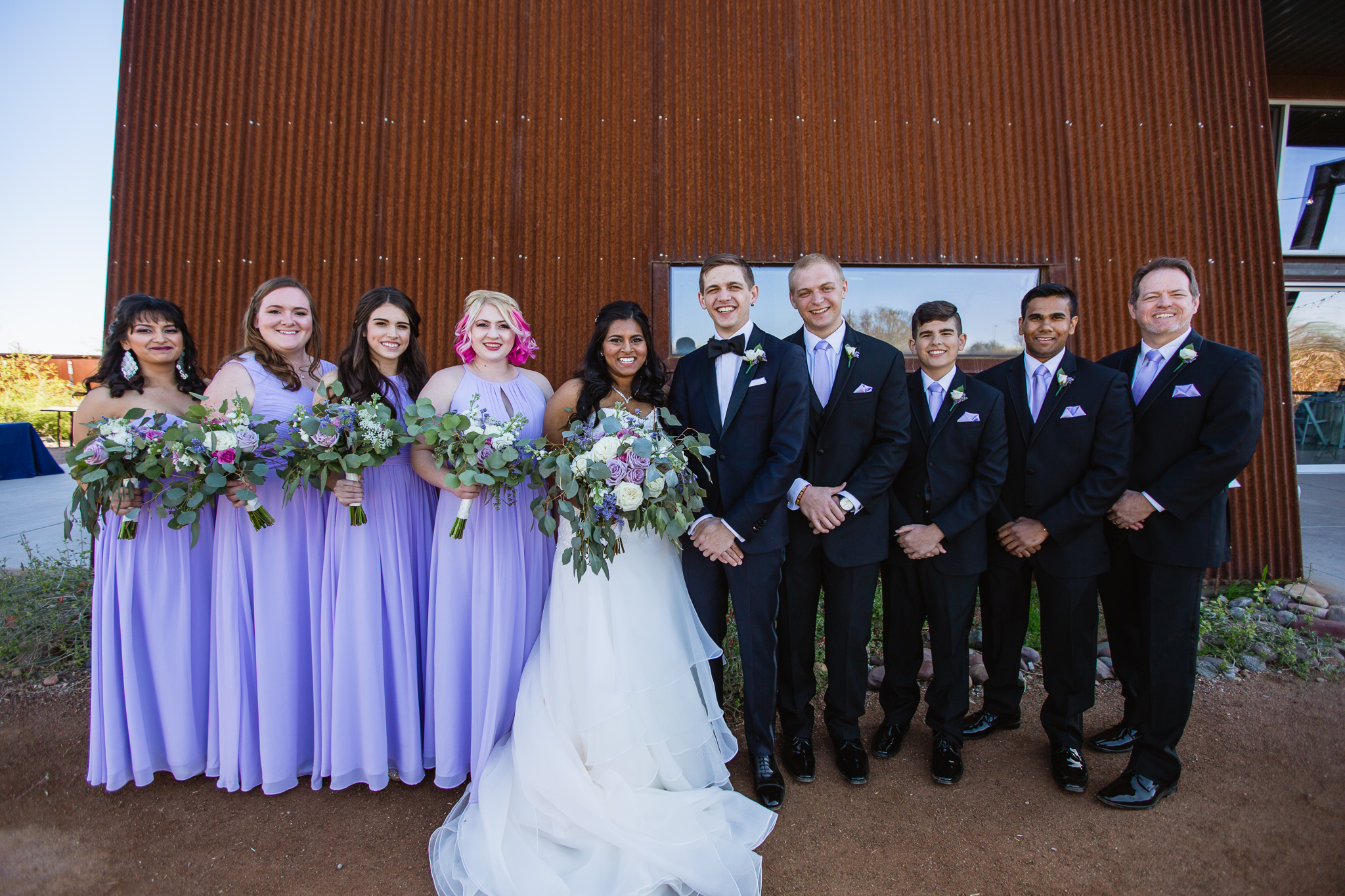 Bride and Groom with bridal party in black suits and lavender dresses at the Rio Salado Audubon Center by Phoenix Wedding Photographers PMA Photography.