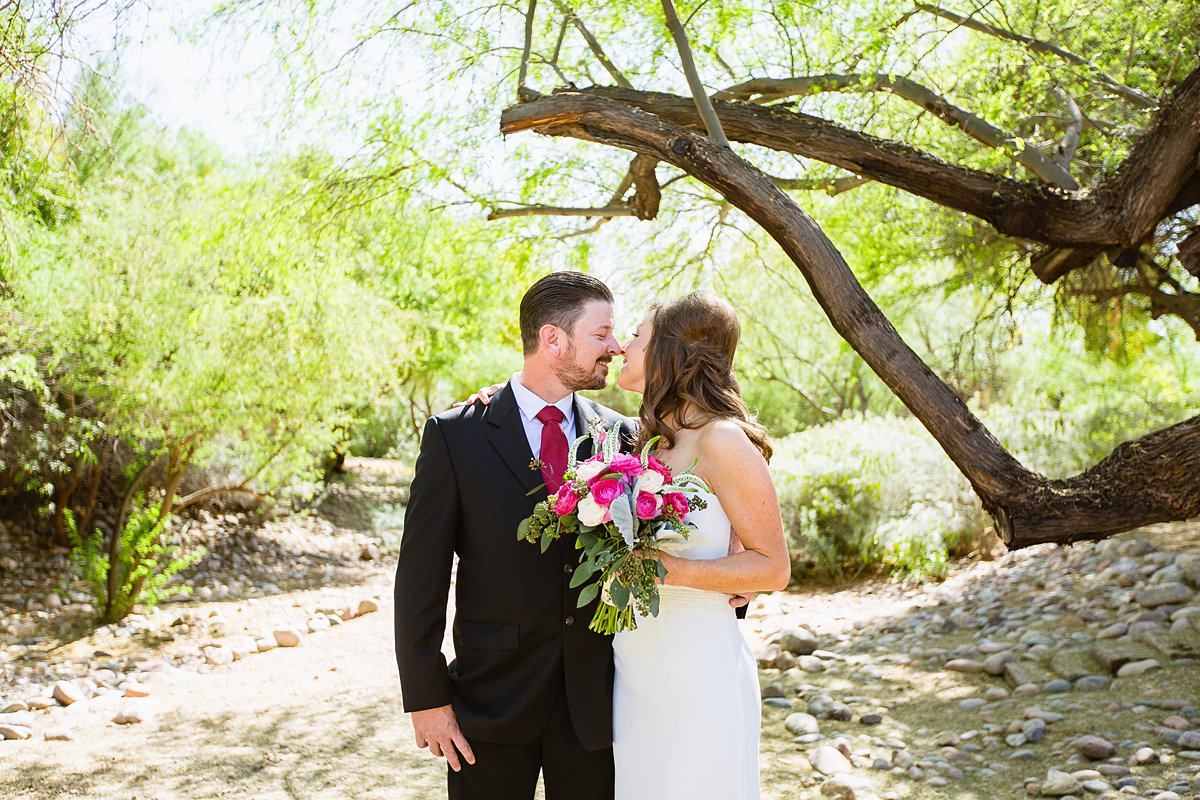 Classic fuchsia/bold pink bride and groom share an intimate moment at Hermosa Inn in Phoenix Arizona by wedding photographers PMA Photography.