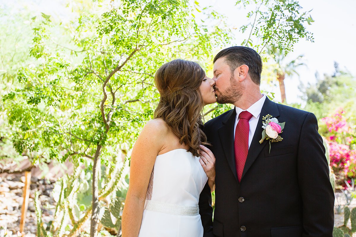 Bride and groom kiss at Hermosa Inn by PMA Photography.