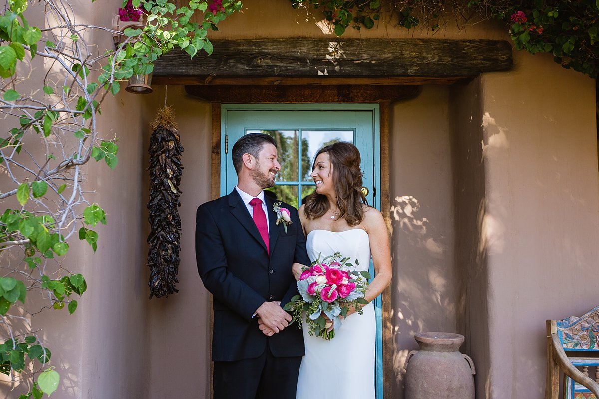 Classic fuchsia/bold pink bride and groom at Hermosa Inn in Phoenix Arizona by wedding photographers PMA Photography.