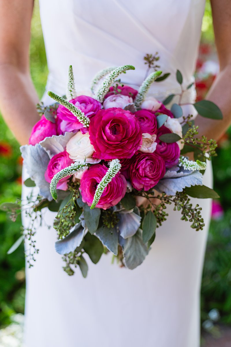 Fuchsia/bold pink ranunculus bridal bouquet by PMA Photography.