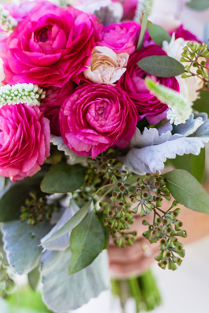 Fuchsia/bold pink ranunculus bridal bouquet by PMA Photography.