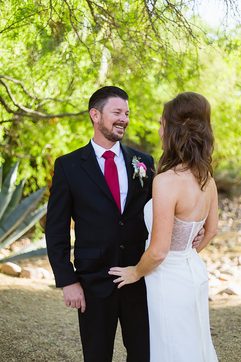 Groom smiling at his bride at Hermosa Inn by PMA Photography.