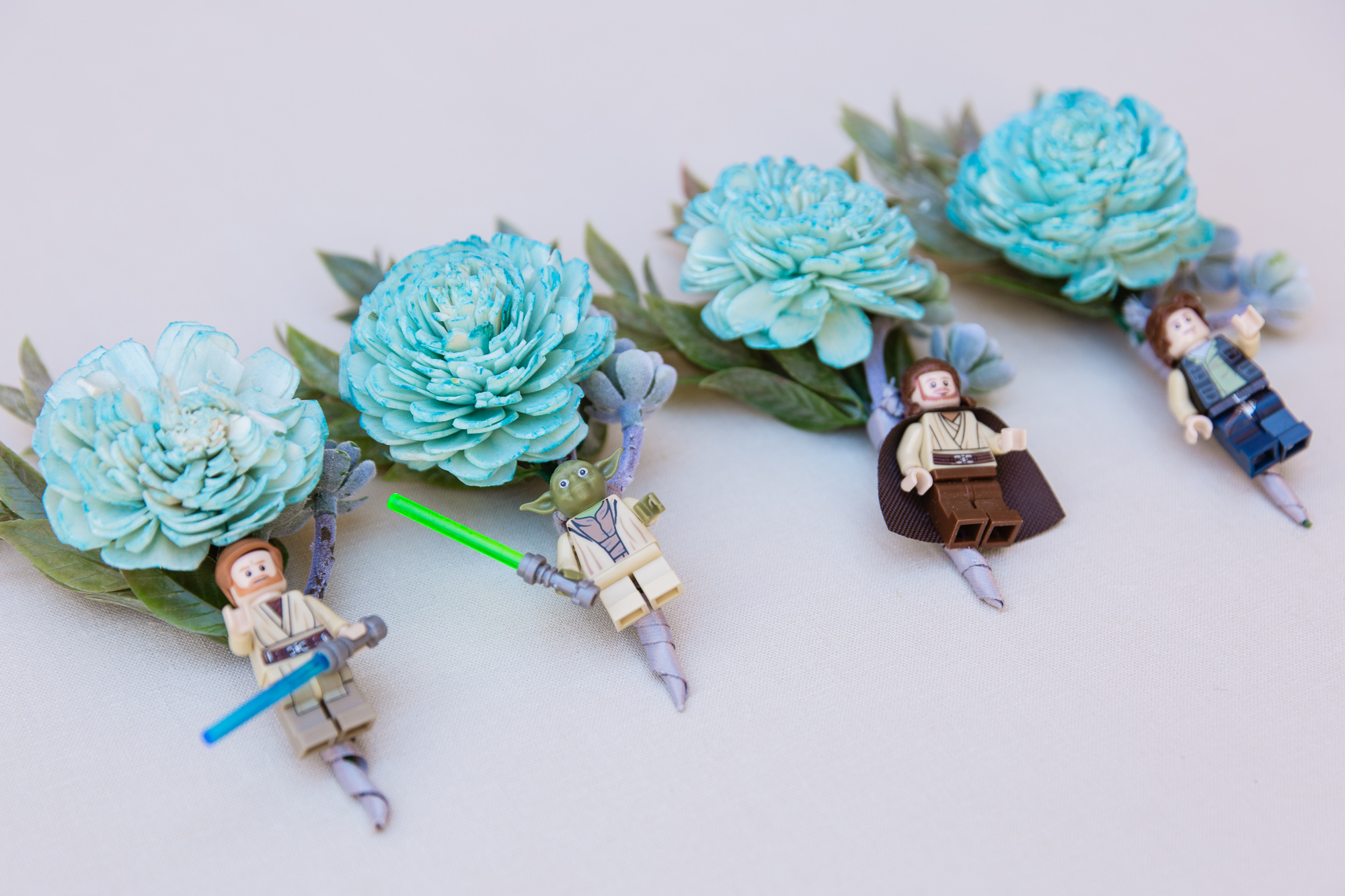 Star Wars Legos and wood flower boutonnieres for the groom and groomsmen by Phoenix wedding photographer PMA Photography.