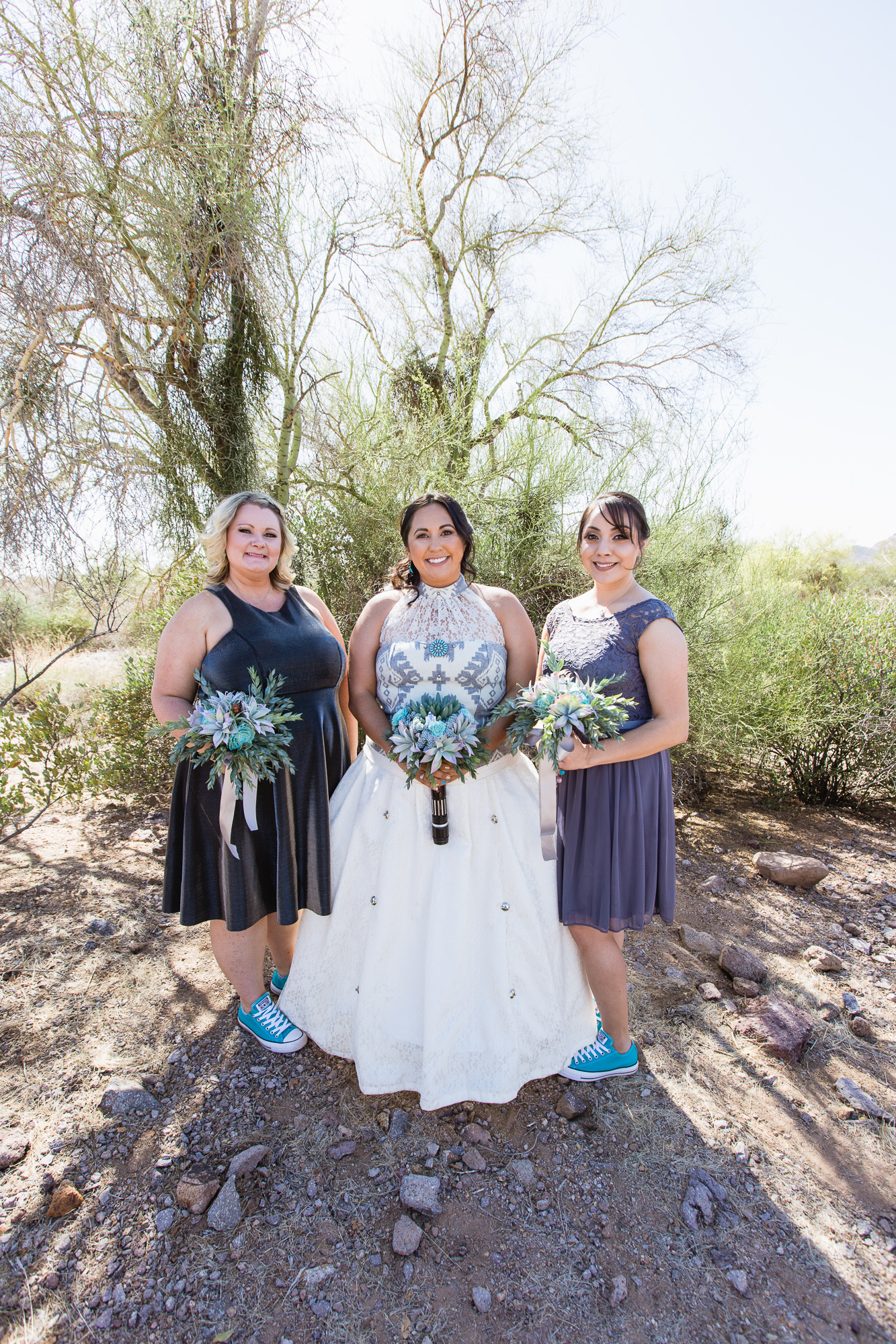 Grey and turquoise bridal party in converse in the Arizona desert by wedding photography by PMA Photography.