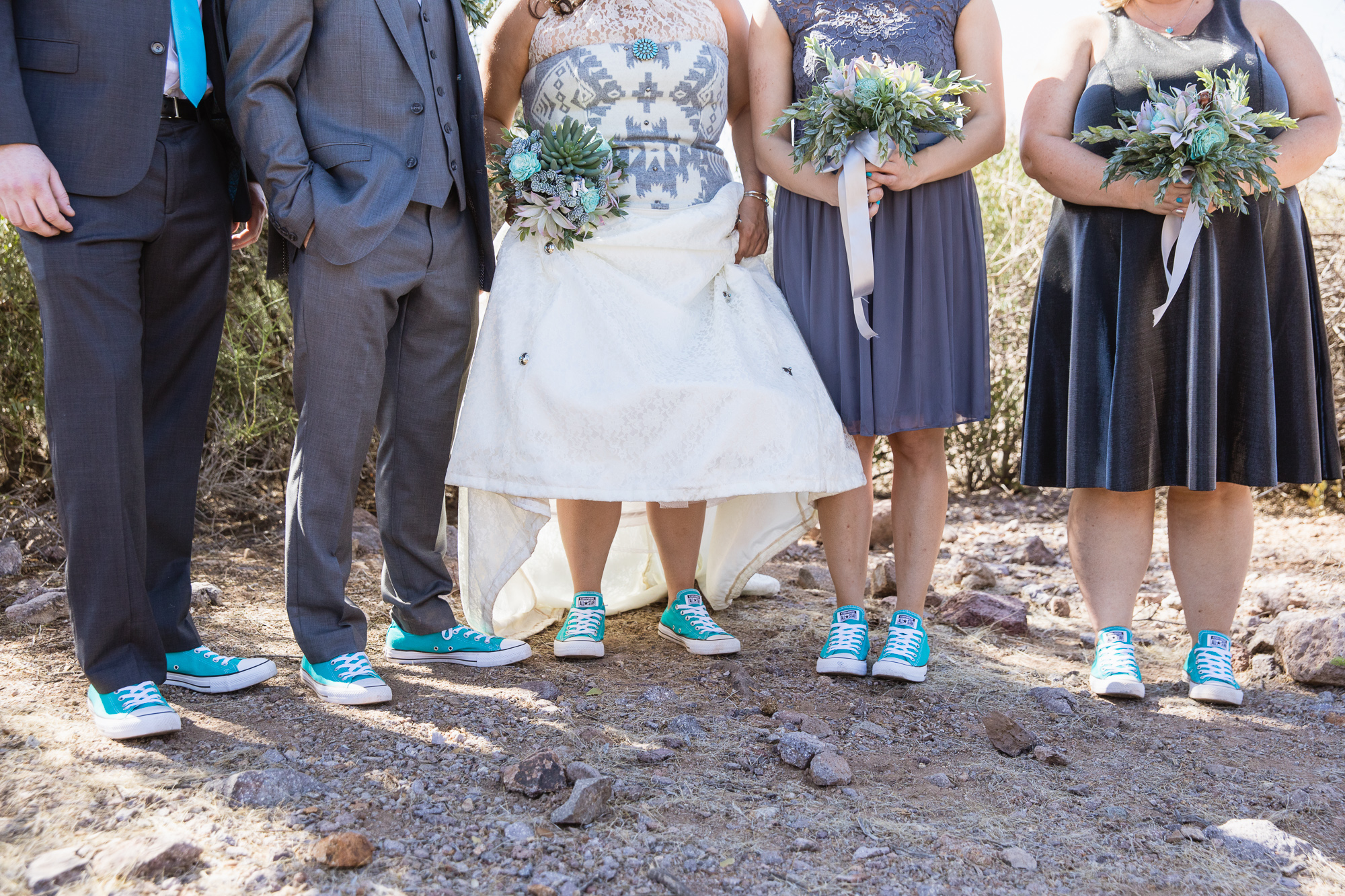 Grey and turquoise bridal party in converse in the Arizona desert by wedding photography by PMA Photography.