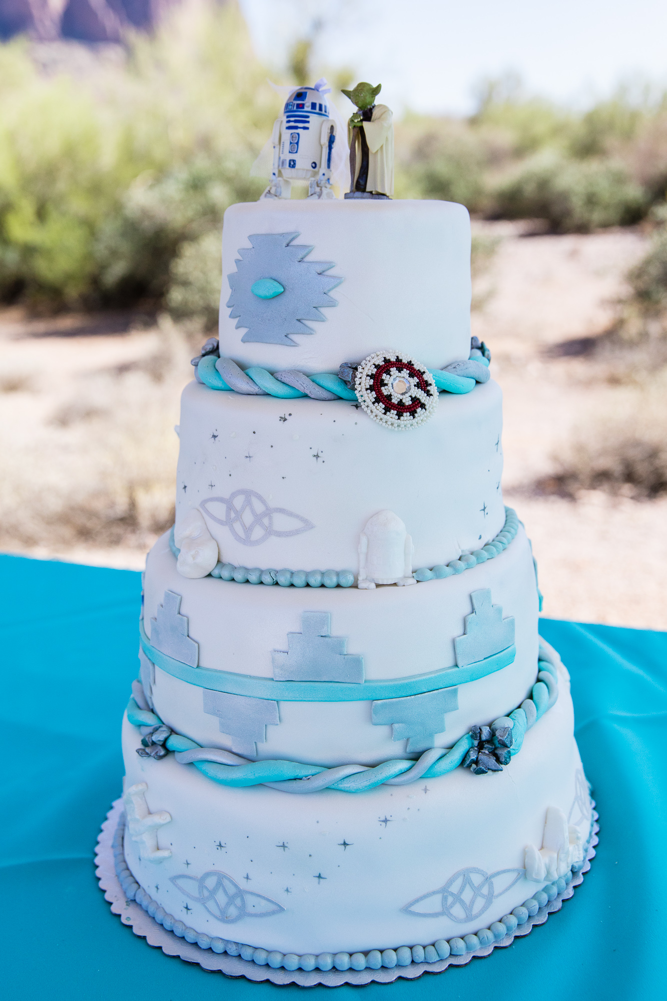 Navajo and Star Wars turquoise and grey wedding cake by wedding photographer PMA Photography.