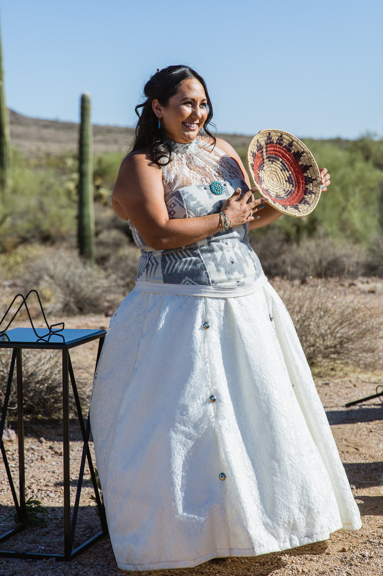 Bride with the Navajo wedding basket during a Lost Dutchman State Park wedding ceremony by Arizona wedding photographers PMA Photography.