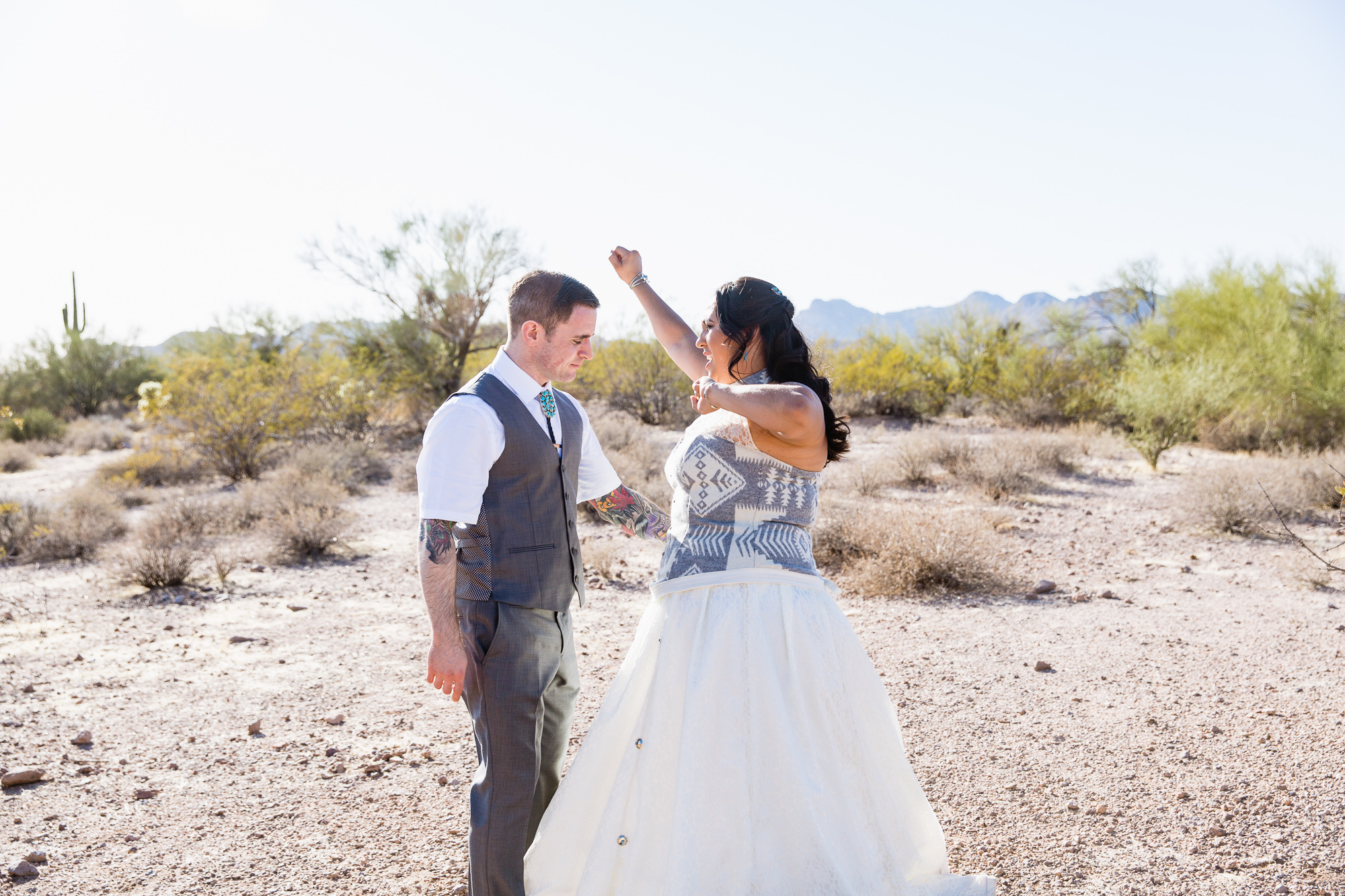 Bride and groom taking a dance break after their wedding ceremony by Arizona wedding photographer PMA Photography.