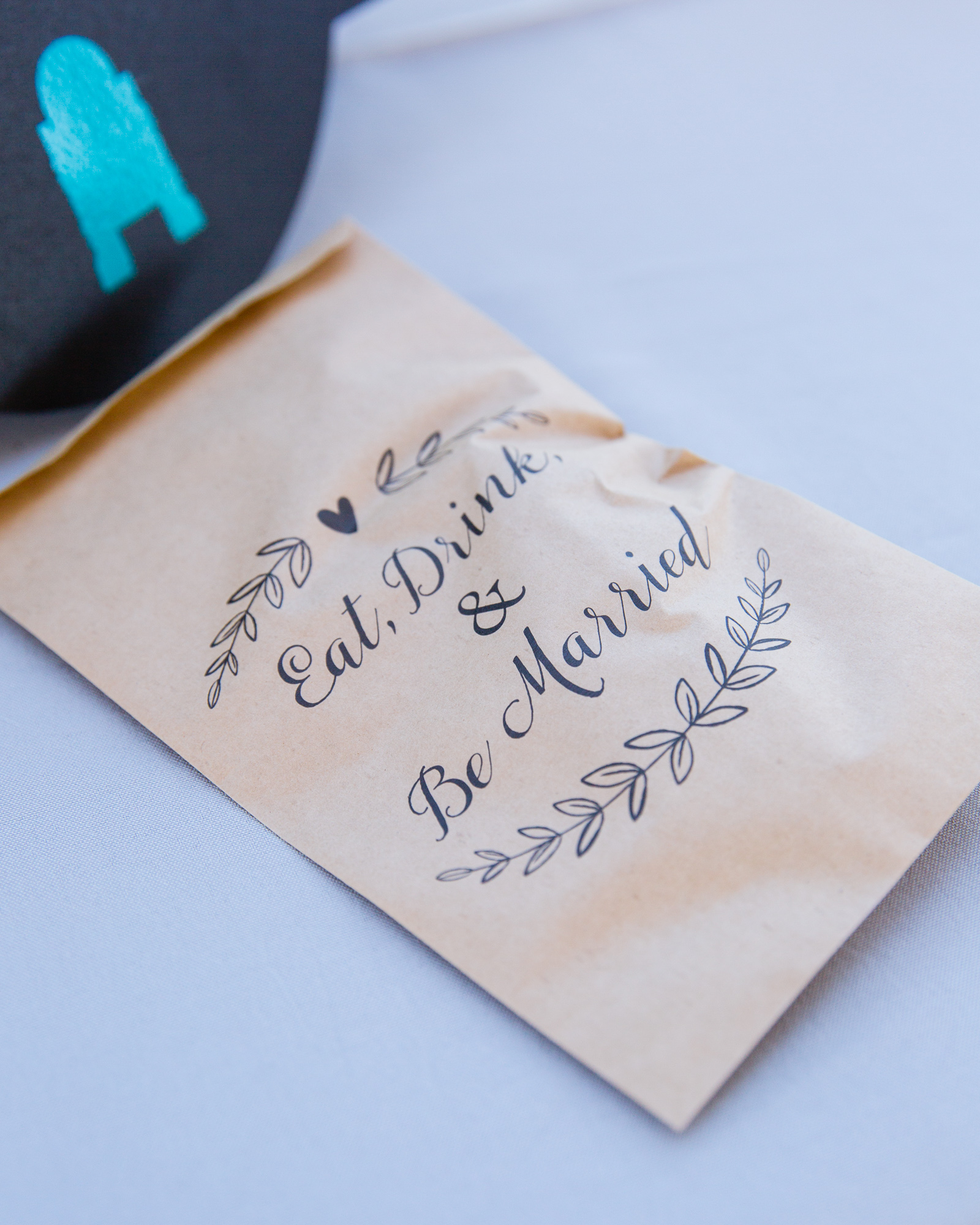 Eat Drink and Be Married kraft paper favor bags by Arizona wedding photographers PMA Photography.