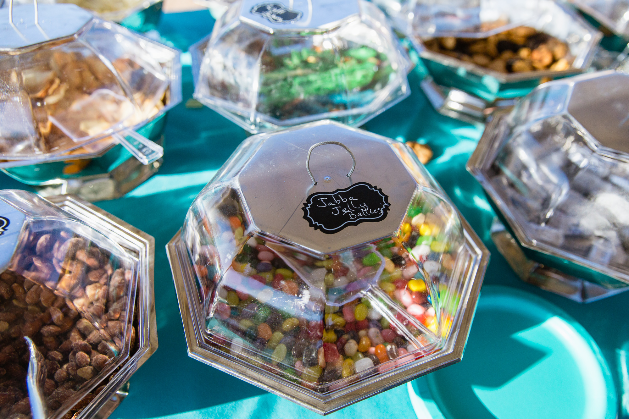 Star Wars themed snack table featuring Jabba Jelly Bellies for cocktail hour by Arizona wedding photographer PMA Photography.