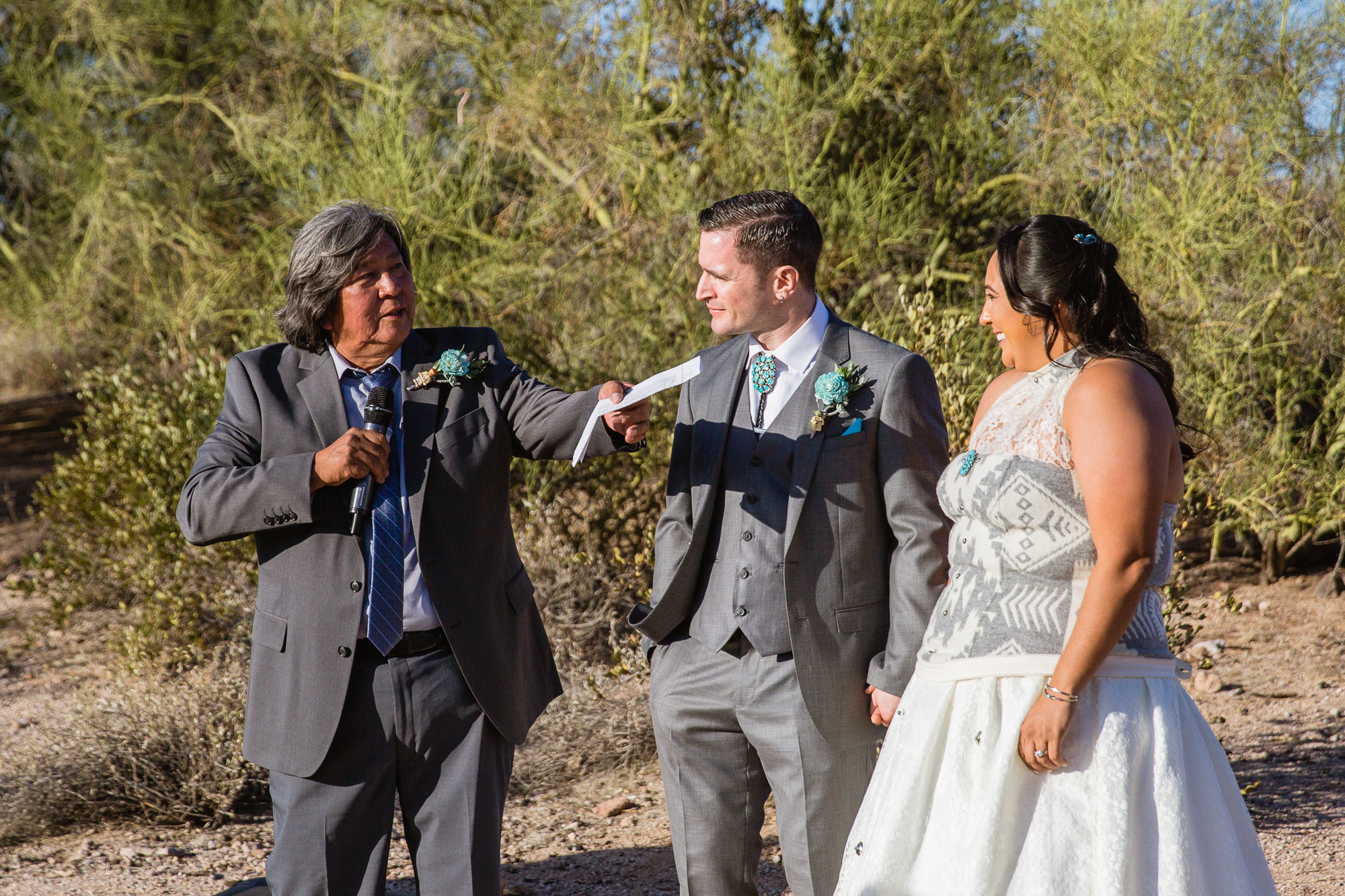 Bride's father giving a toast at the wedding reception at Lost Dutchman State Park by Arizona wedding photographer PMA Photography.