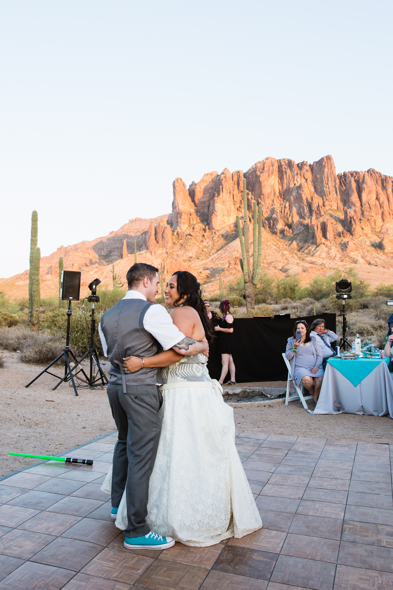 Bride and grooms first dance at their Lost Dutchman State Park wedding reception by Arizona wedding photographer PMA Photography.