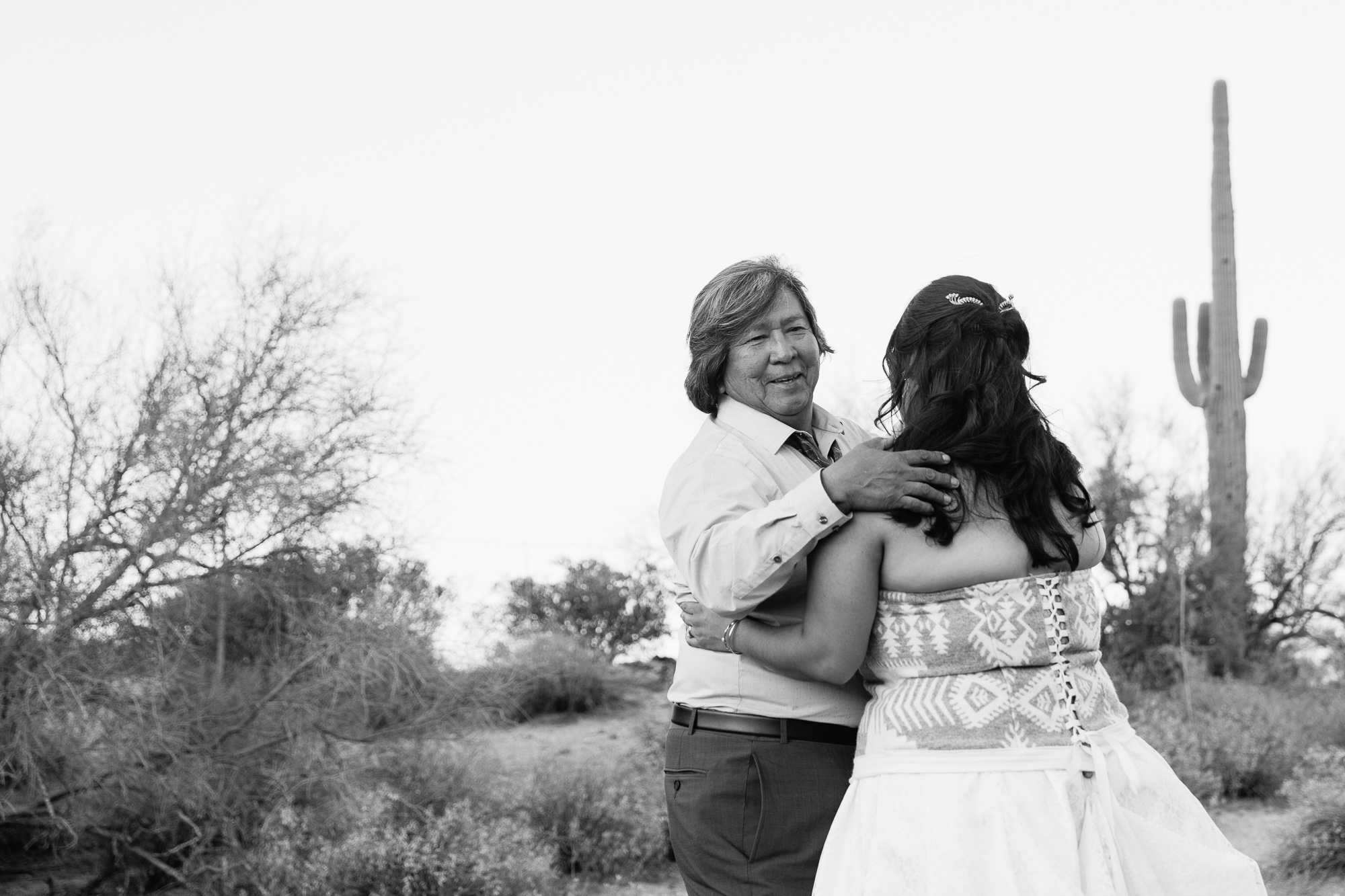 Black and white image of the father daughter dance in the desert by PMA Photography.
