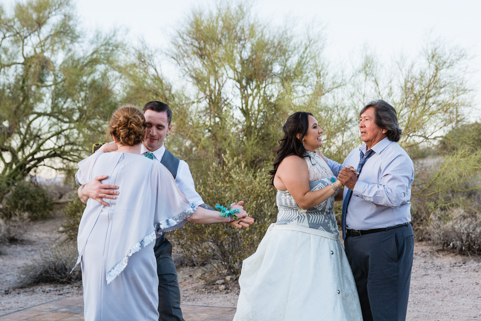 Shared father daughter and mother son dance wedding reception alternative in the desert by Arizona wedding photographer PMA Photography.