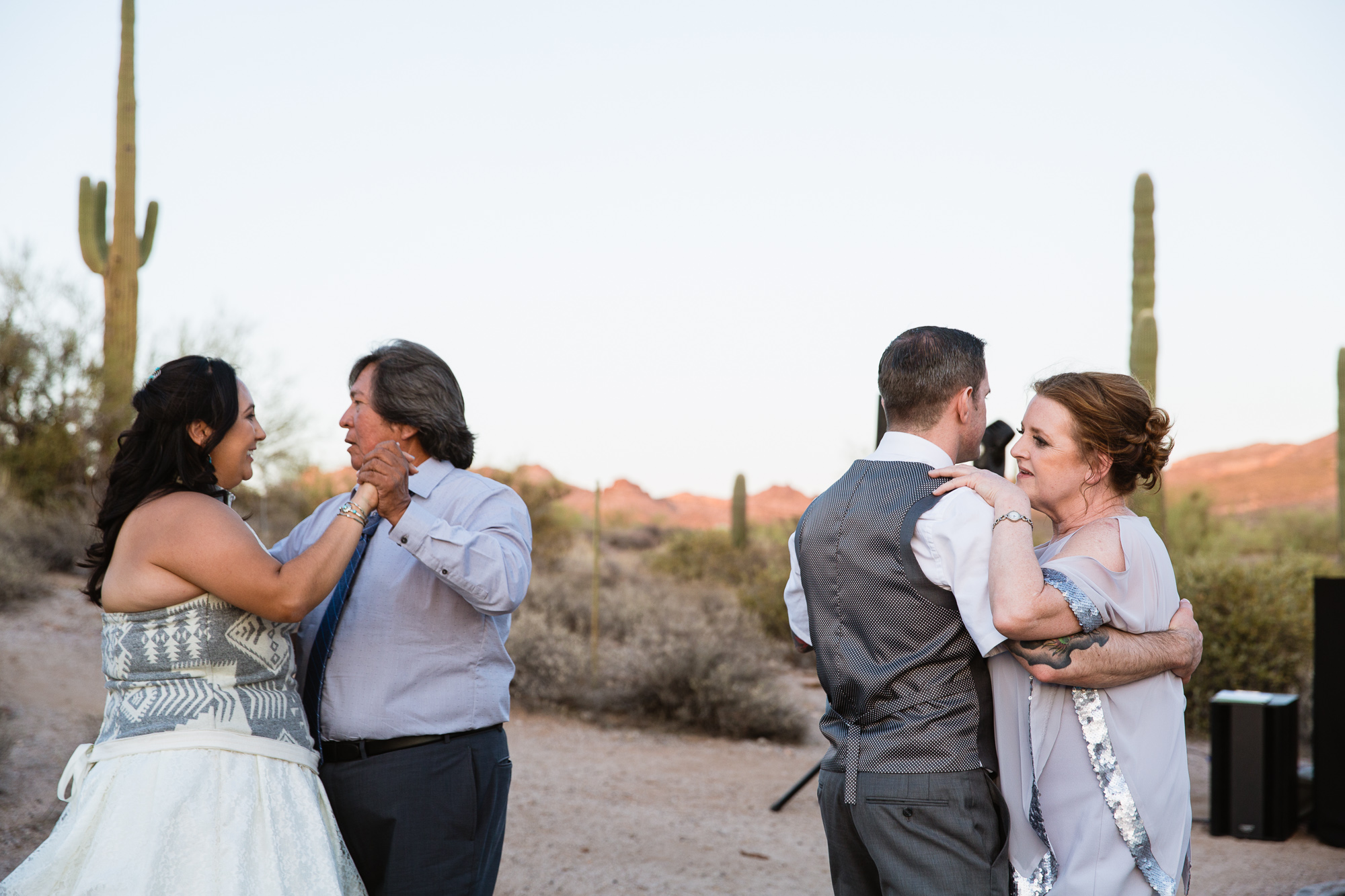Shared father daughter and mother son dance wedding reception alternative in the desert by Arizona wedding photographer PMA Photography.