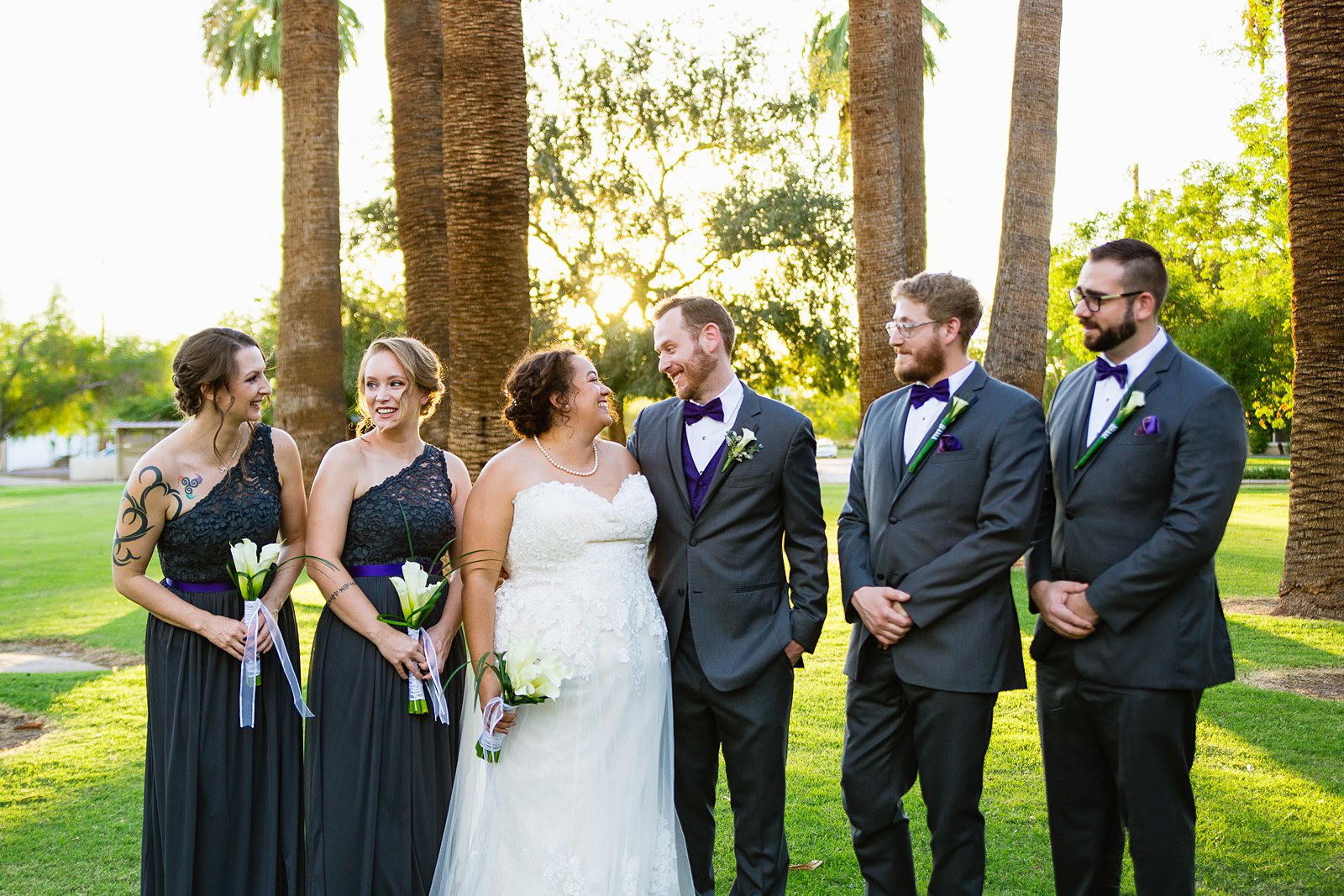 Bridal party together at a Encanto Park wedding by Arizona wedding photographer PMA Photography.