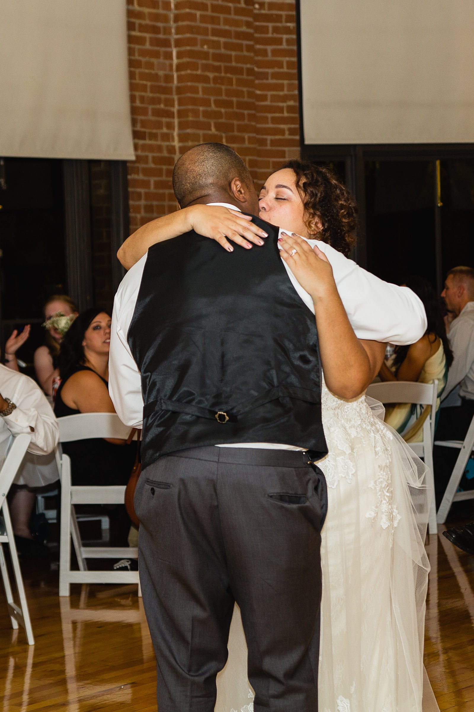 Bride dancing with her father at Encanto Park wedding by Phoenix wedding photographer PMA Photography.