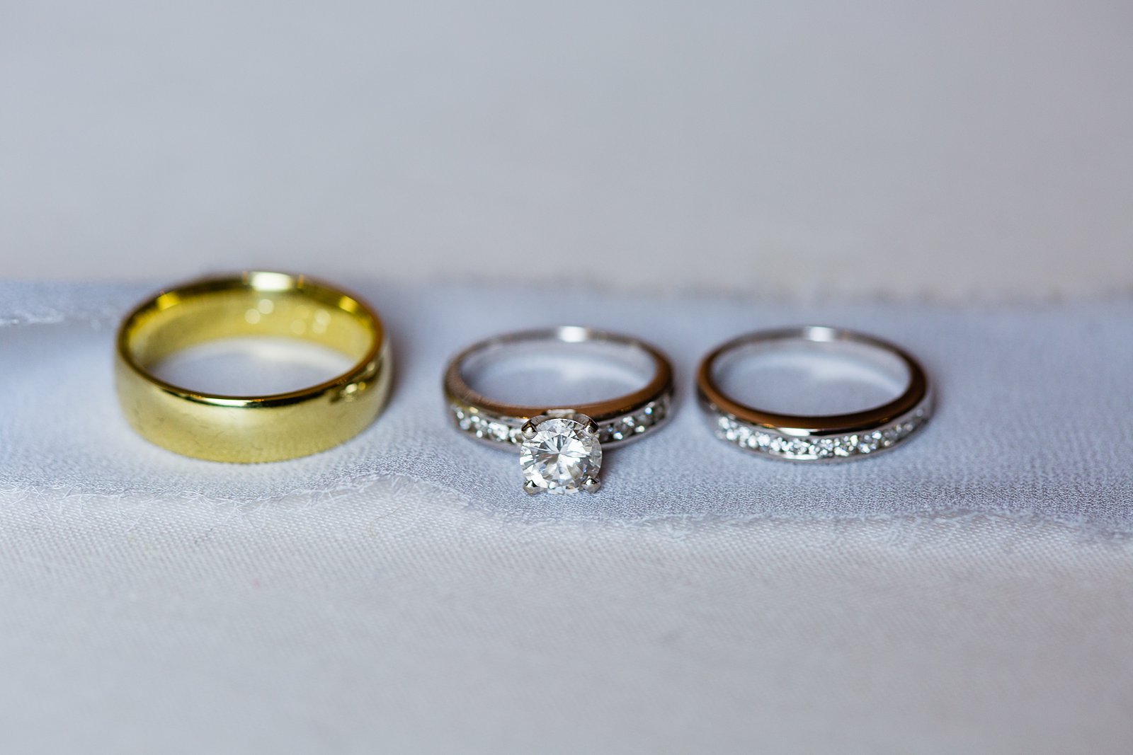 Bride and grooms simple wedding bands by PMA Photography.