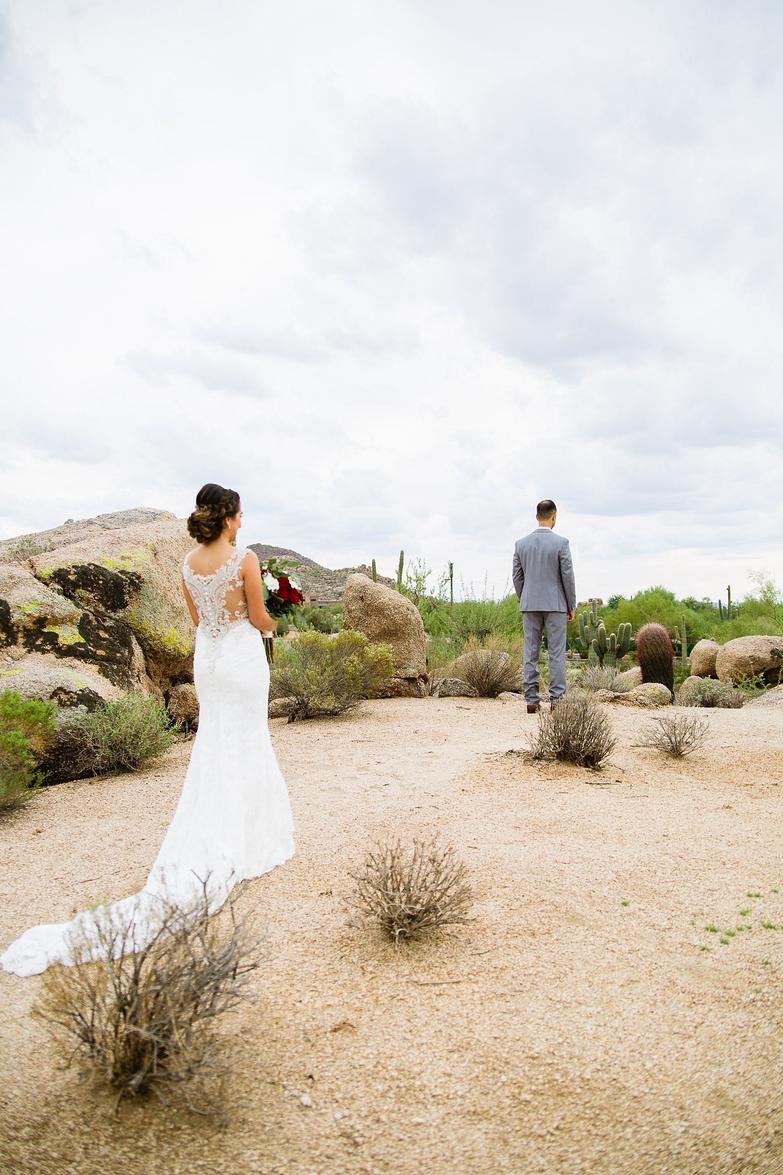 Bride and groom's first look at Troon North by Arizona wedding photographer PMA Photography.