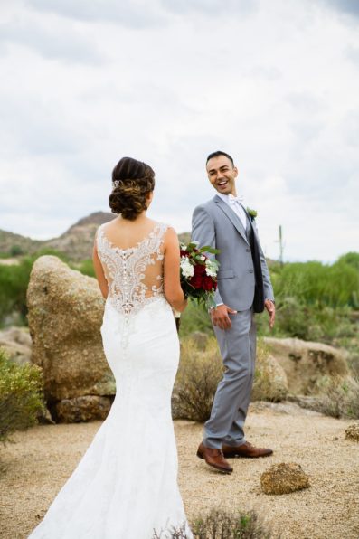 Bride and groom's first look at Troon North by Arizona wedding photographer PMA Photography.